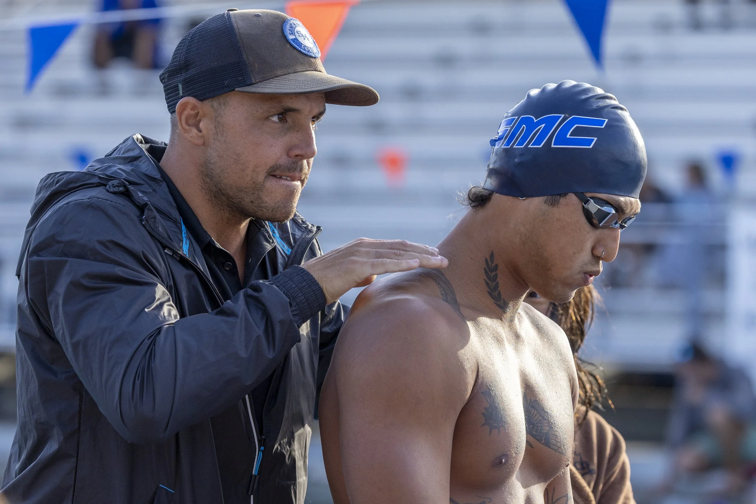 (L-R) Tom Briskey, assistant swim coach, stands with Corsair Rohan Lee before his upcoming race in the finals of the men’s 50m Freestyle of the 3C2A State Championship on Thursday, April 30, 2026, at the Orange Coast College Pool in Costa Mesa, Cali