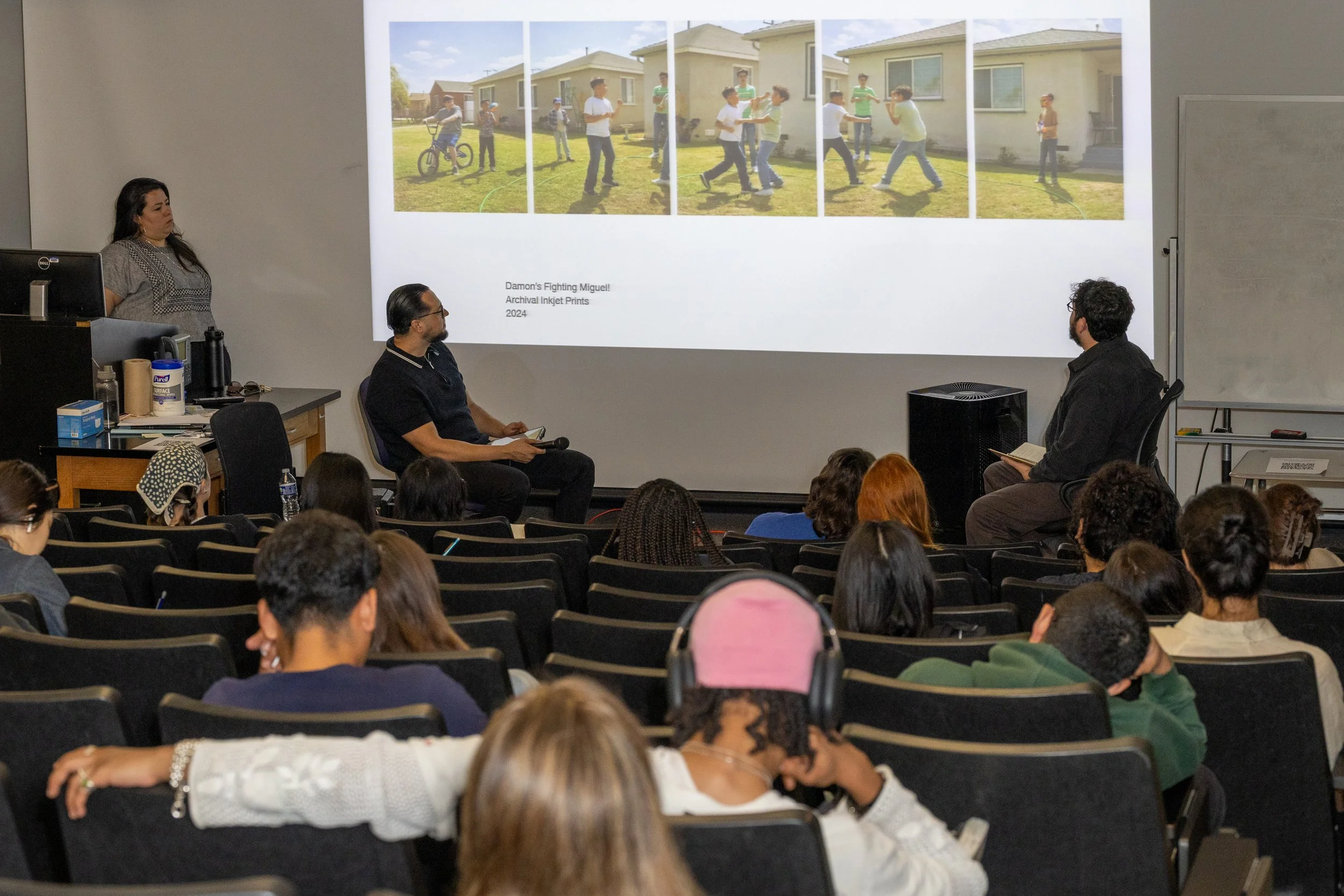  (L-R) Erika Hirugami, Santa Monica College (SMC) Art History Professor and moderator, Antonio Perez, first-generation Mexican-American artist, and Damon Casarez, an Artist specializing in photography, discuss one of Casarez’s projects about childhoo