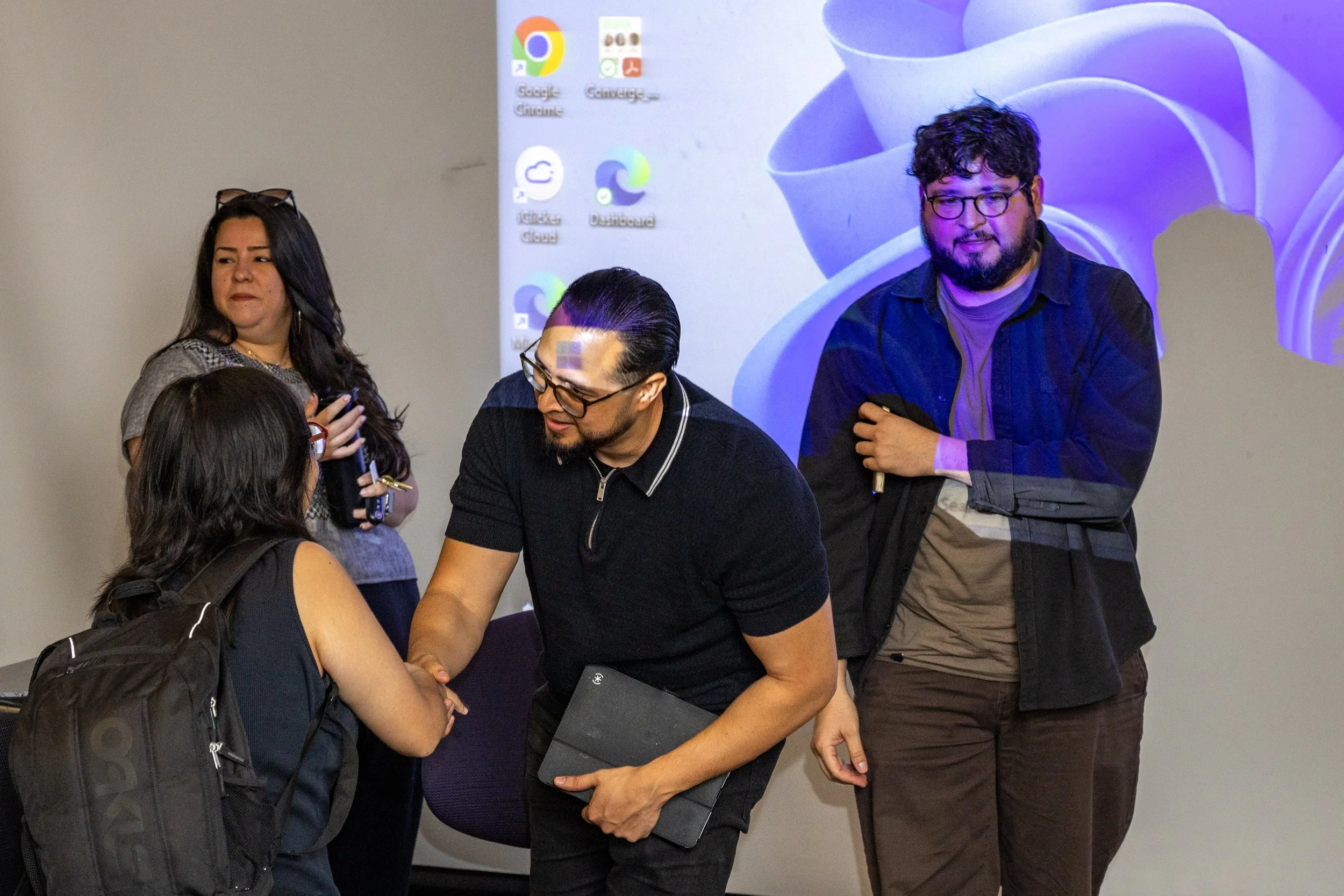  Antonio Perez (center), first-generation Mexican-American artist and speaker at the event ‘Concrete Hope artists in Conversation’, meets a Santa Monica College (SMC) student after his presentation in room A214 in the Art Building at SMC Main Campus 