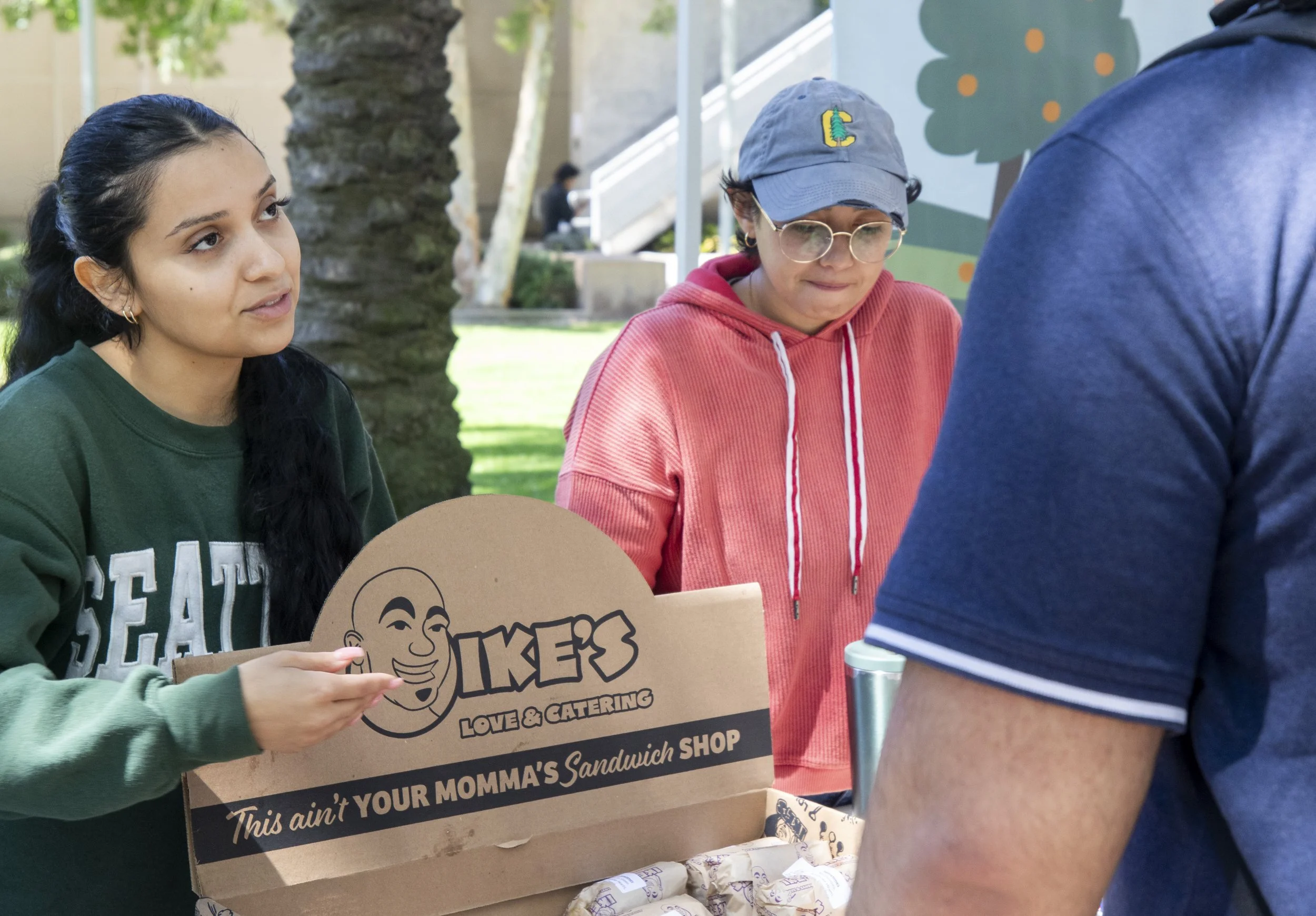  Santa Monica College (SMC) students Danielle Toledo (Left) and Nasim Jahangard-Mahboob (cq.) (Right) hand out Ike’s sandwiches to students at the Sustainability Fest on the SMC main campus quad on Thursday, April 23rd, 2026. Toledo and Jahangard-Mah