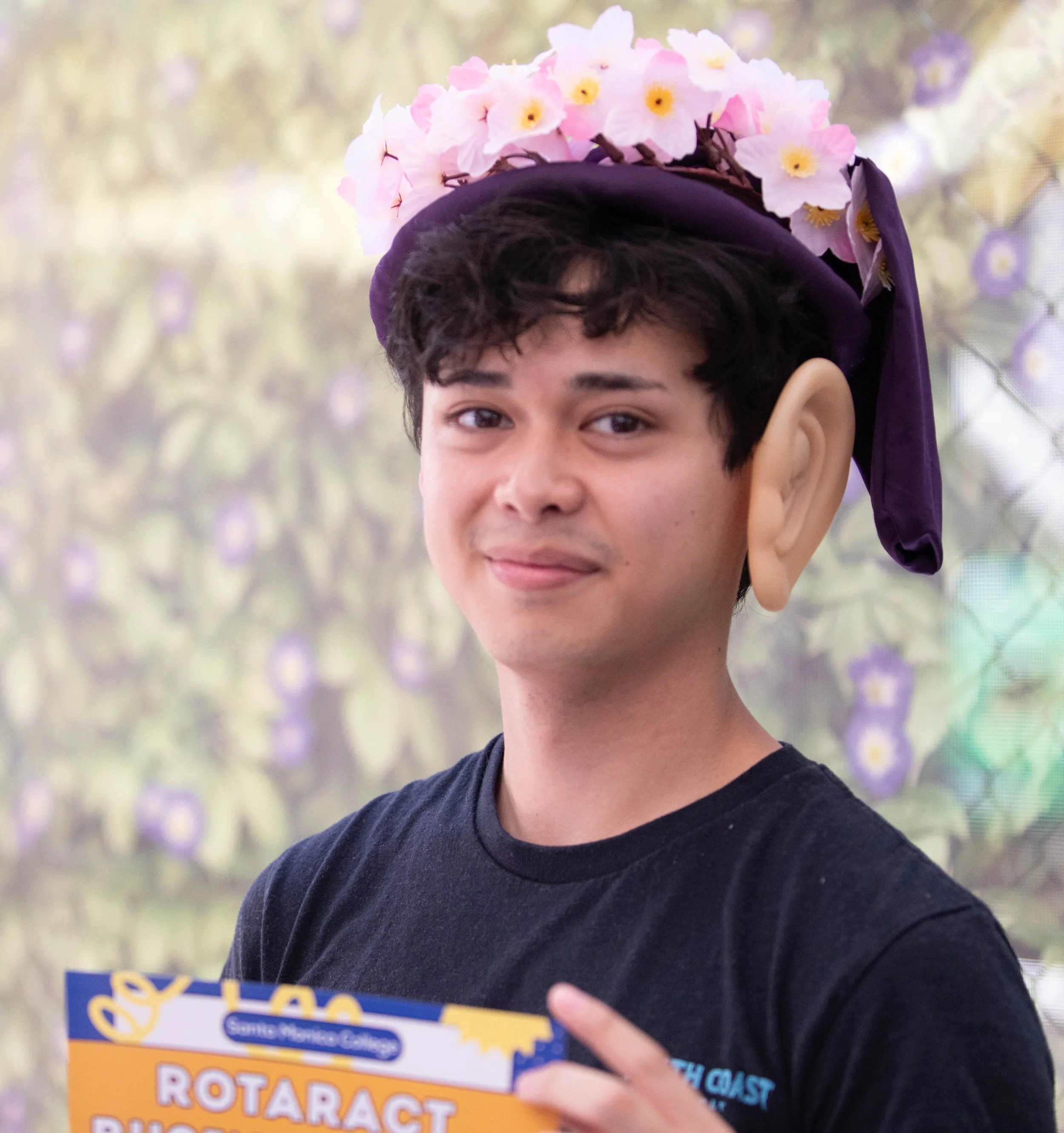  Zack Tatsumi, the Social Media Coordinator of Santa Monica College's (SMC) Rotaract Business Club represents his club at the SMC fairy-tale themed Spring Club Row on Thursday, May 7 2026 at the SMC Main Campus Quad. (Maria Lebedev | The Corsair) 