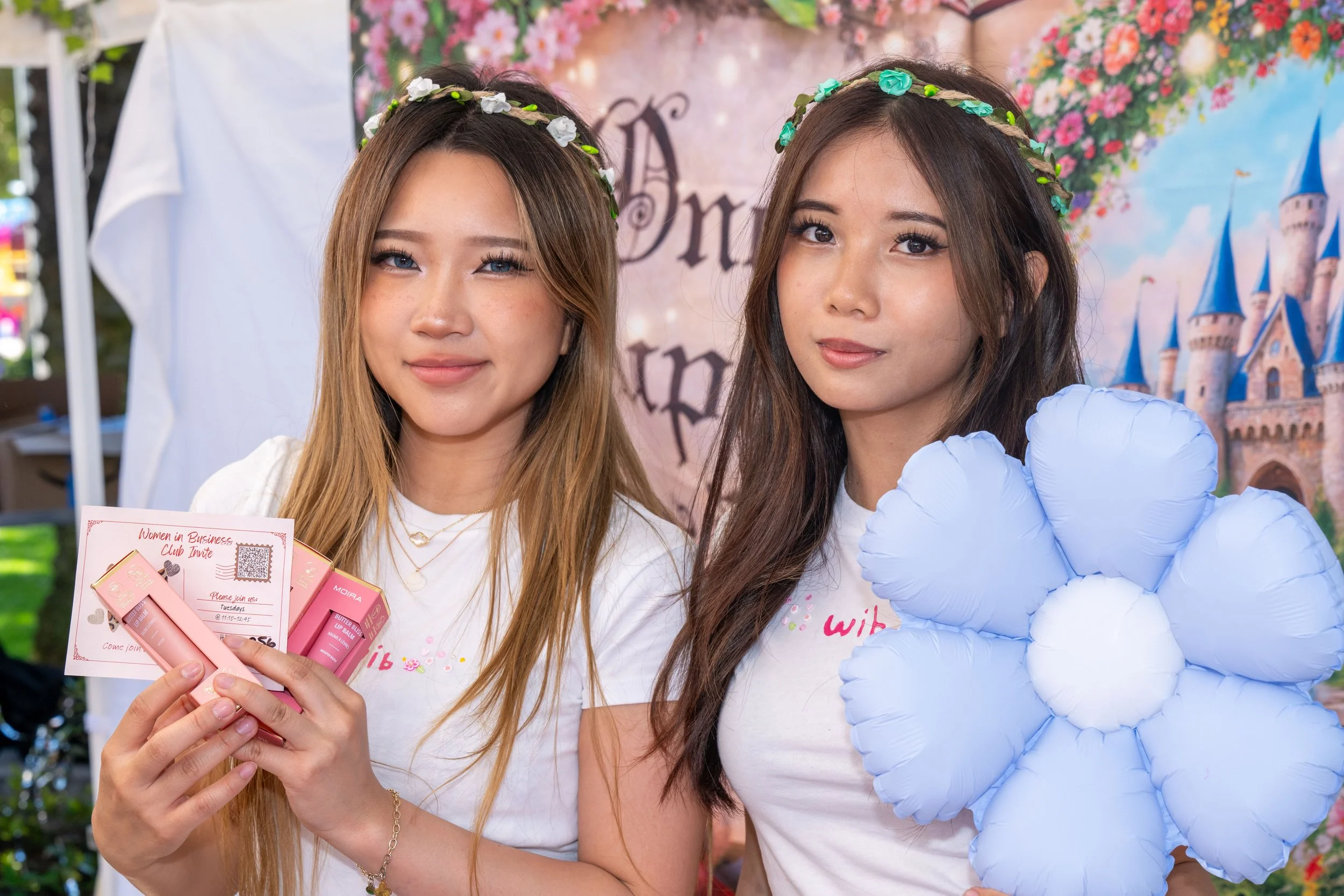  Santa Monica College (SMC) students and Co-Presidents Martha Martinez, a communication major, and Emilia Goh, a business economics major, showcase products and wear their newly printed shirts featuring the Women in Business club's "WIB" logo at Club
