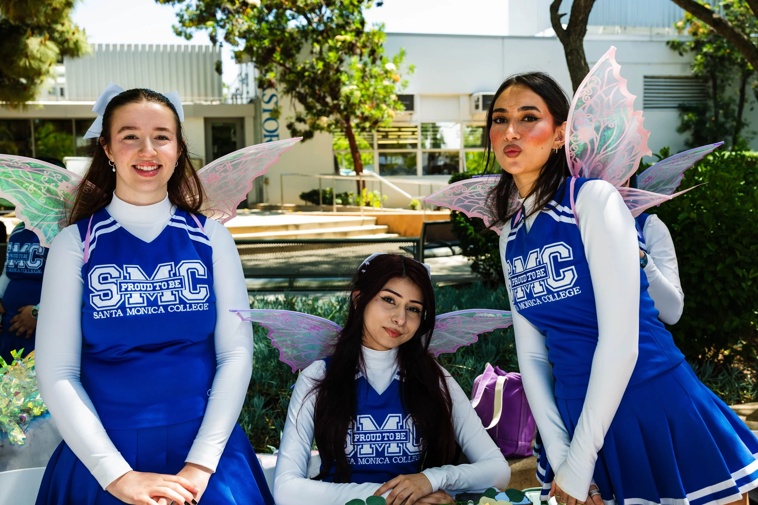  Santa Monica College students (L to R) Amanda Bruers, technology theatre major; Sarah Ramirez, mathematics major; and Deniz Sahin, architecture major, staff the Cheer Club booth during Club Row on May 7, 2026, in Santa Monica, California. (Tom Rosho