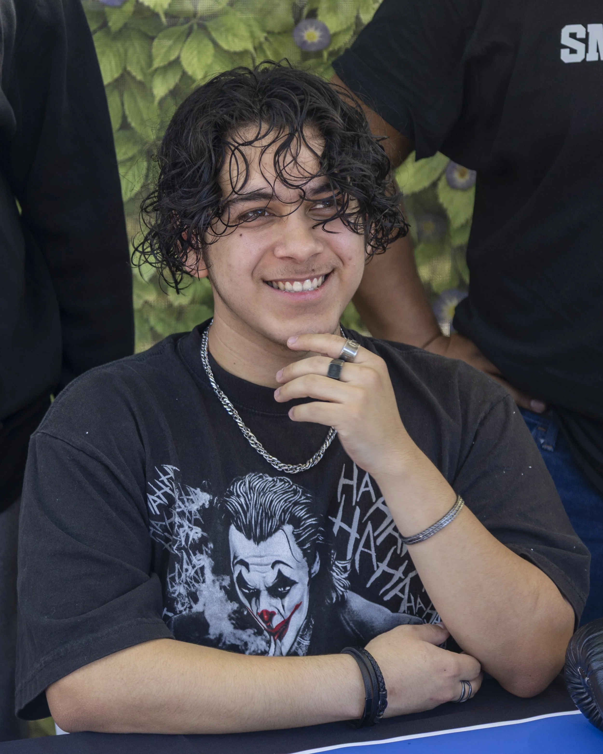  Joshua Diaz of the Boxing Club sits at their booth on the Santa Monica College campus, Thursday, May 8, in Santa Monica, Calif., during the Club Row event. The Boxing Club, like many other clubs, had a sign-up sheet available to passersby. (Juliana 