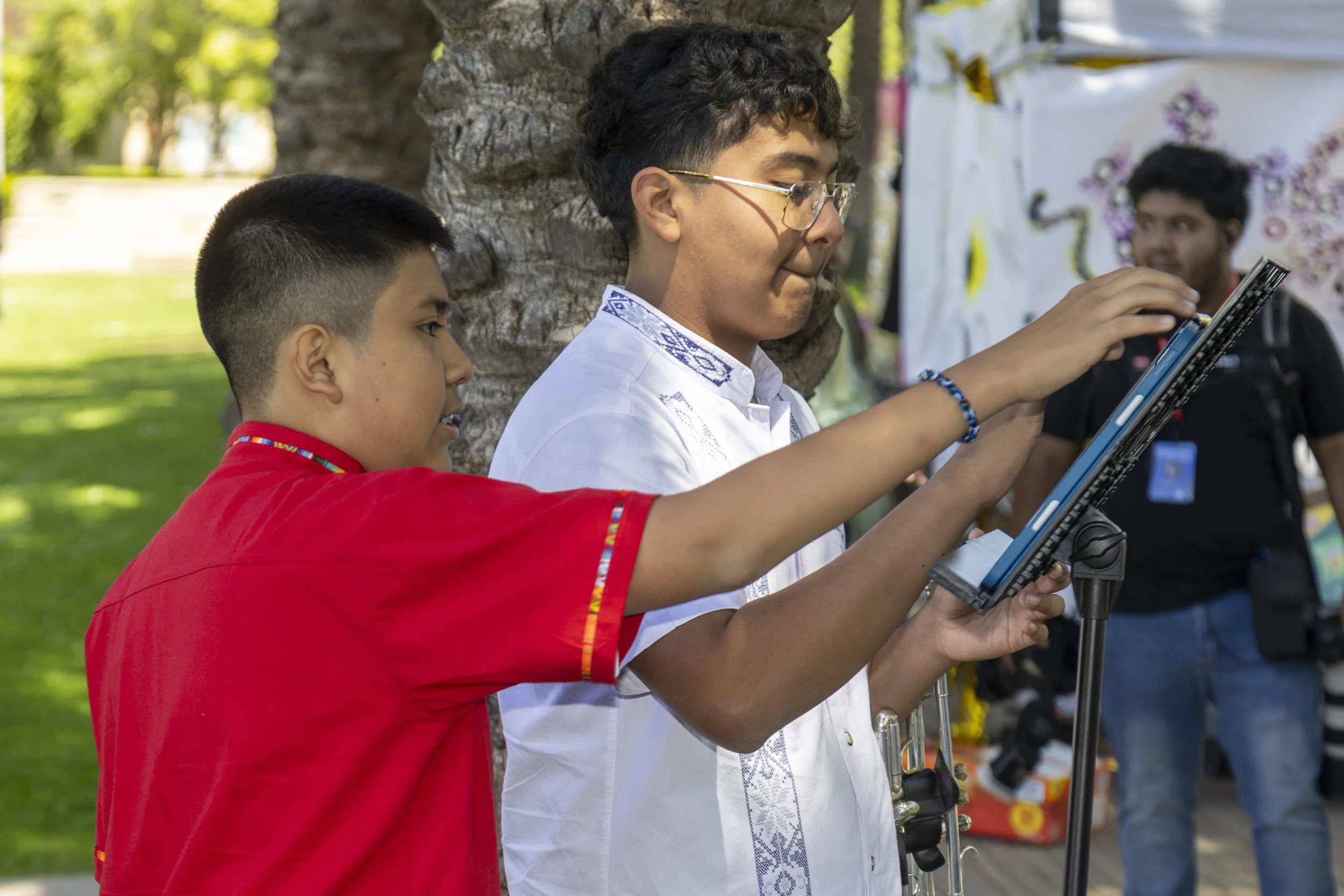  A member of the Banda Los Corsarios, a student organization which bills itself as "The Banda Oaxaqueña at Santa Monica College" (SMC)on the Santa Monica College campus, sets up their sheet music Thursday, May 8, in Santa Monica, Calif., during the C