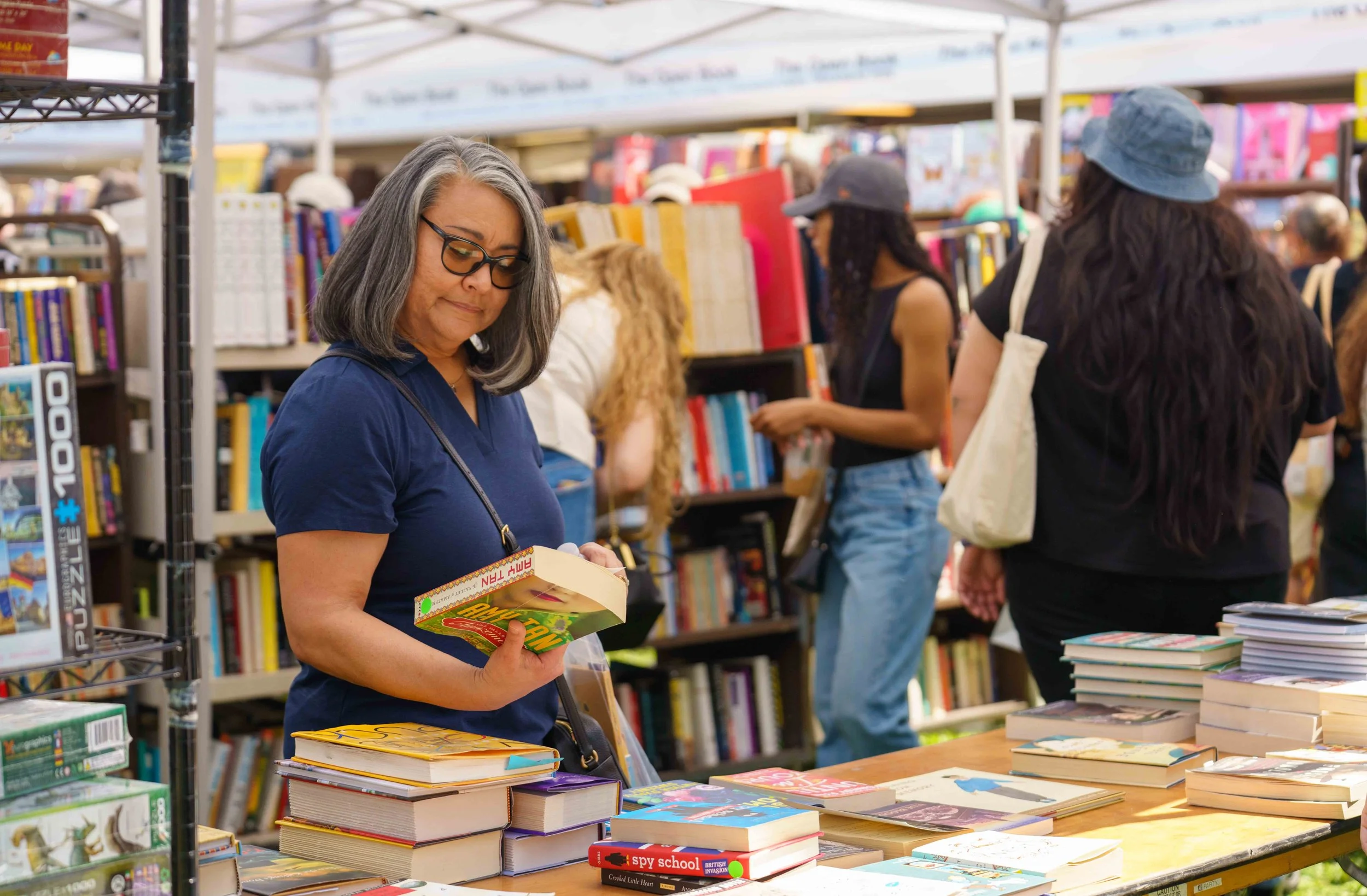  Attendees browse books for sale during Los Angeles Times Festival of Books, Saturday, April 18, 2026. A literary festival that began in 1996, this year’s two-day annual L.A. Times Festival of Books spanned eight outdoor stages and 12 indoor venues w
