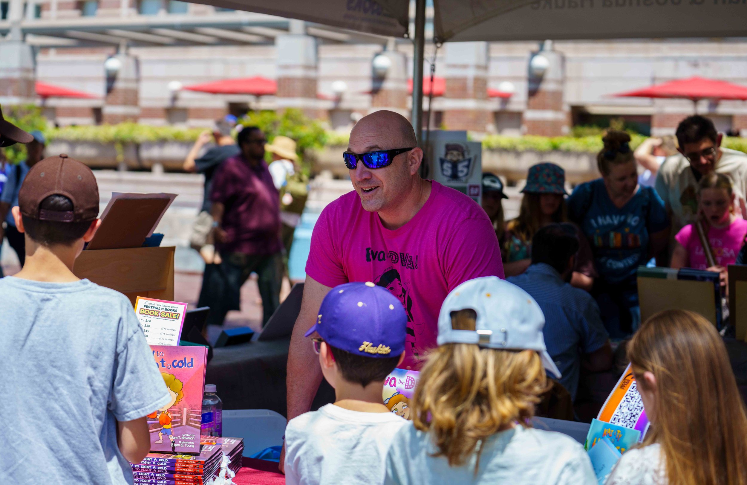  Children's book author Adam T. Newman (center) during Los Angeles Times Festival of Books, Saturday, April 18, 2026. This year’s two-day festival spanned eight outdoor stages and 12 indoor venues with author interviews, book signings, panel discussi