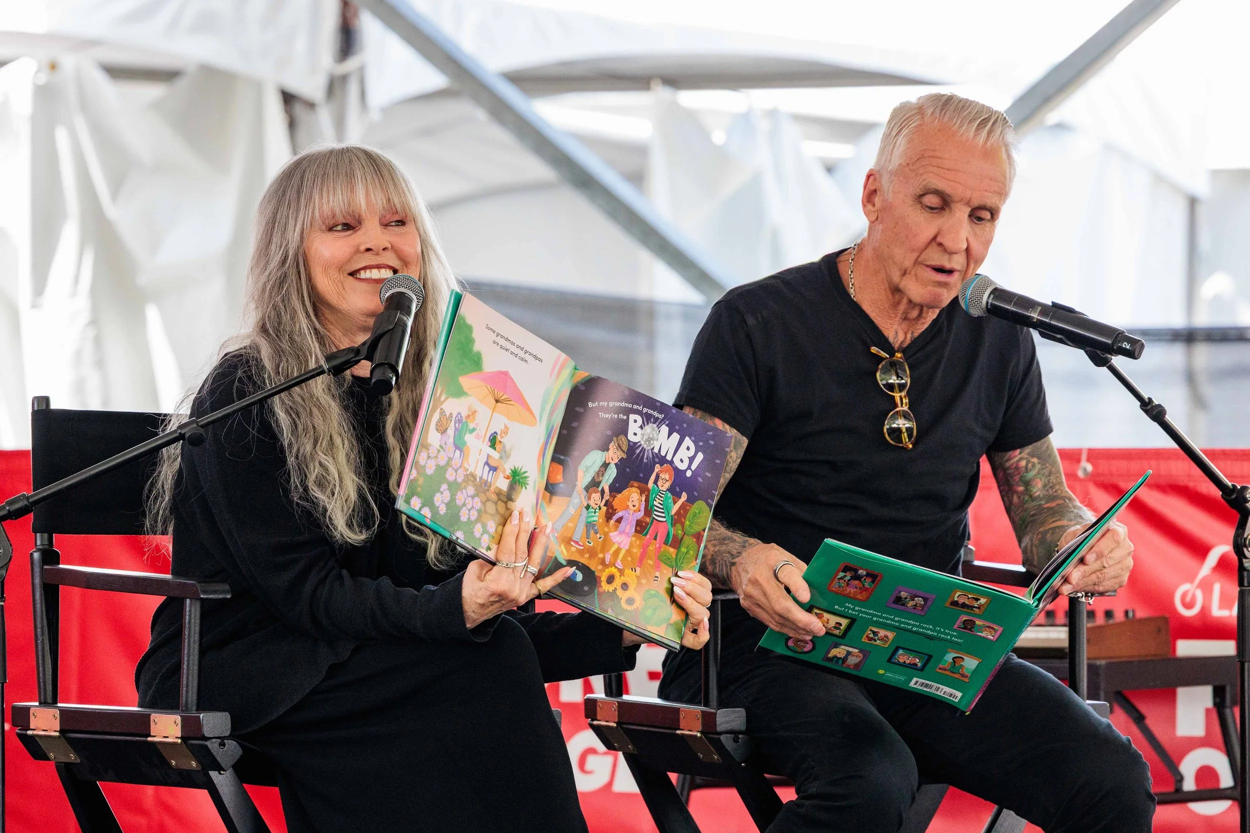 (L-R) Platinum winning musician couple, singer-songwriter Pat Benatar and guitarist-songwriter Neil Giraldo, read from their children's book, "My Grandma and Grandpa Rock!" during the 31st annual Los Angeles Times Festival of Books held at Universit