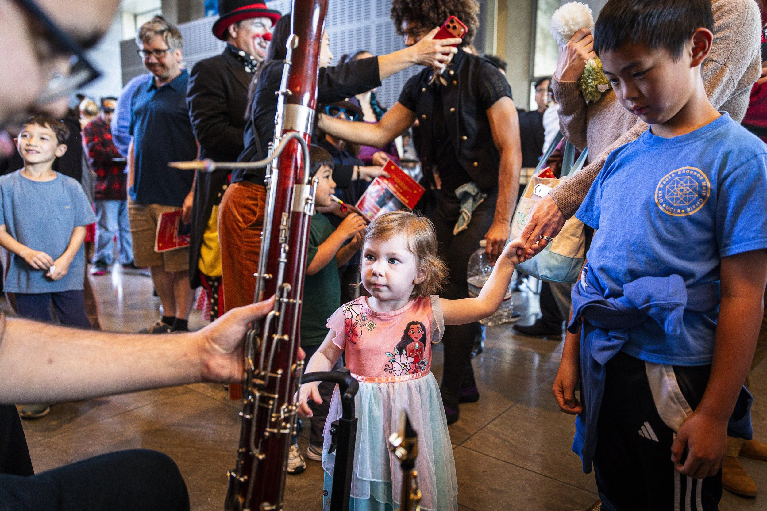  Two kids interact with a basson during an instrument petting zoo with members of the Santa Monica College (SMC) Symphony Orchestra, after a special children’s concert on Sunday, April 26, 2026, at BroadStage at the SMC Performing Arts Center in Sant