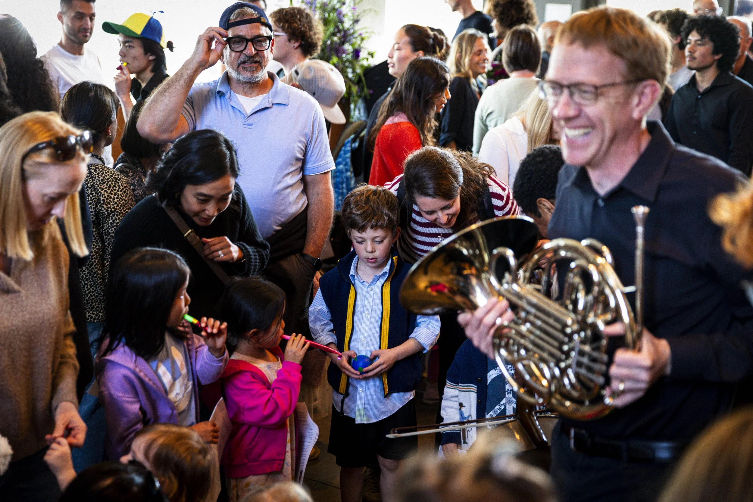  Children and their families enjoy an instrument petting zoo with members of the Santa Monica College (SMC) Symphony Orchestra, after a special children’s concert on Sunday, April 26, 2026, at BroadStage at the SMC Performing Arts Center in Santa Mon