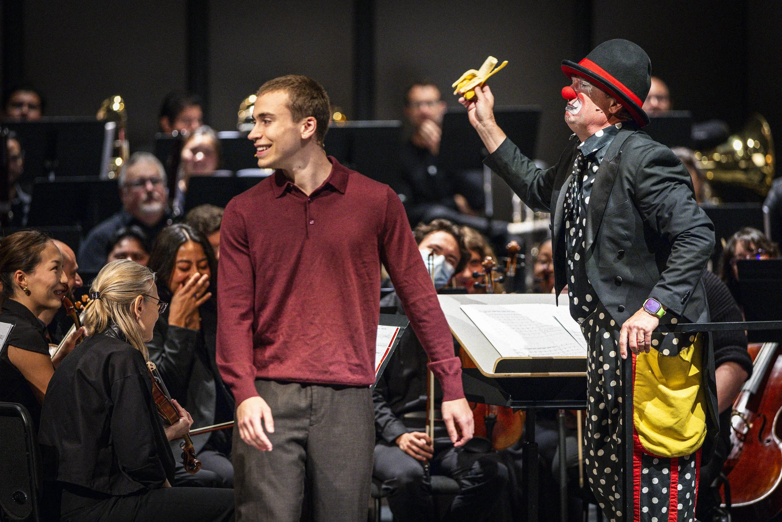  Santa Monica College (SMC) student and narrator Nate Hathaway (R), and Guilford “Gilly the Clown” Adams (R) performing during the SMC Symphony Orchestra special children’s concert on Sunday, April 26, 2026, at BroadStage at the SMC Performing Arts C