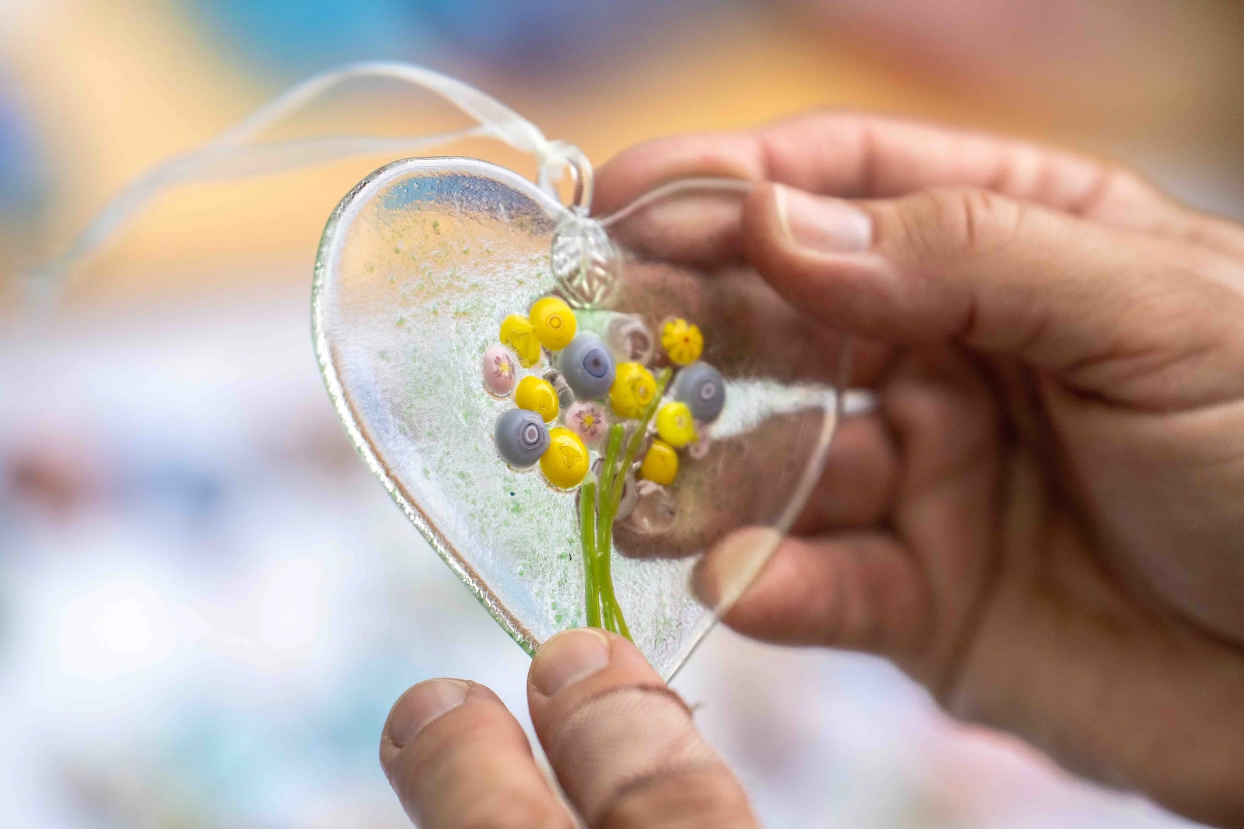  Santa Monica College (SMC) glass fusing artist Janet Zander holds one of her pieces during SMC Art Department's Mother's Day Glass Sale at Virginia Park Farmers Market in Santa Monica, Calif., Saturday, May 2, 2026. The glass sale featured handmade 
