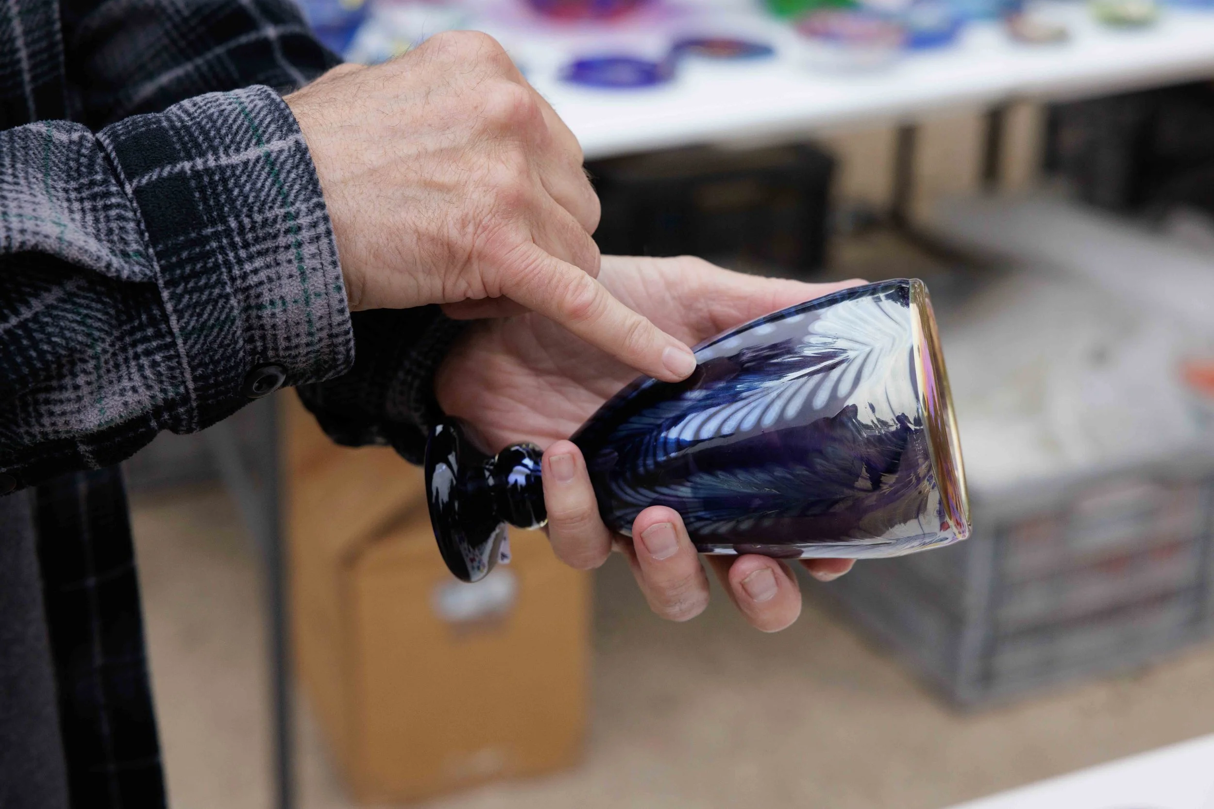  Santa Monica College (SMC) laboratory technician Andy Berney holds one of his pieces during SMC Art Department's Mother's Day Glass Sale at Virginia Park Farmers Market in Santa Monica, Calif., Saturday, May 2, 2026. The glass sale featured handmade