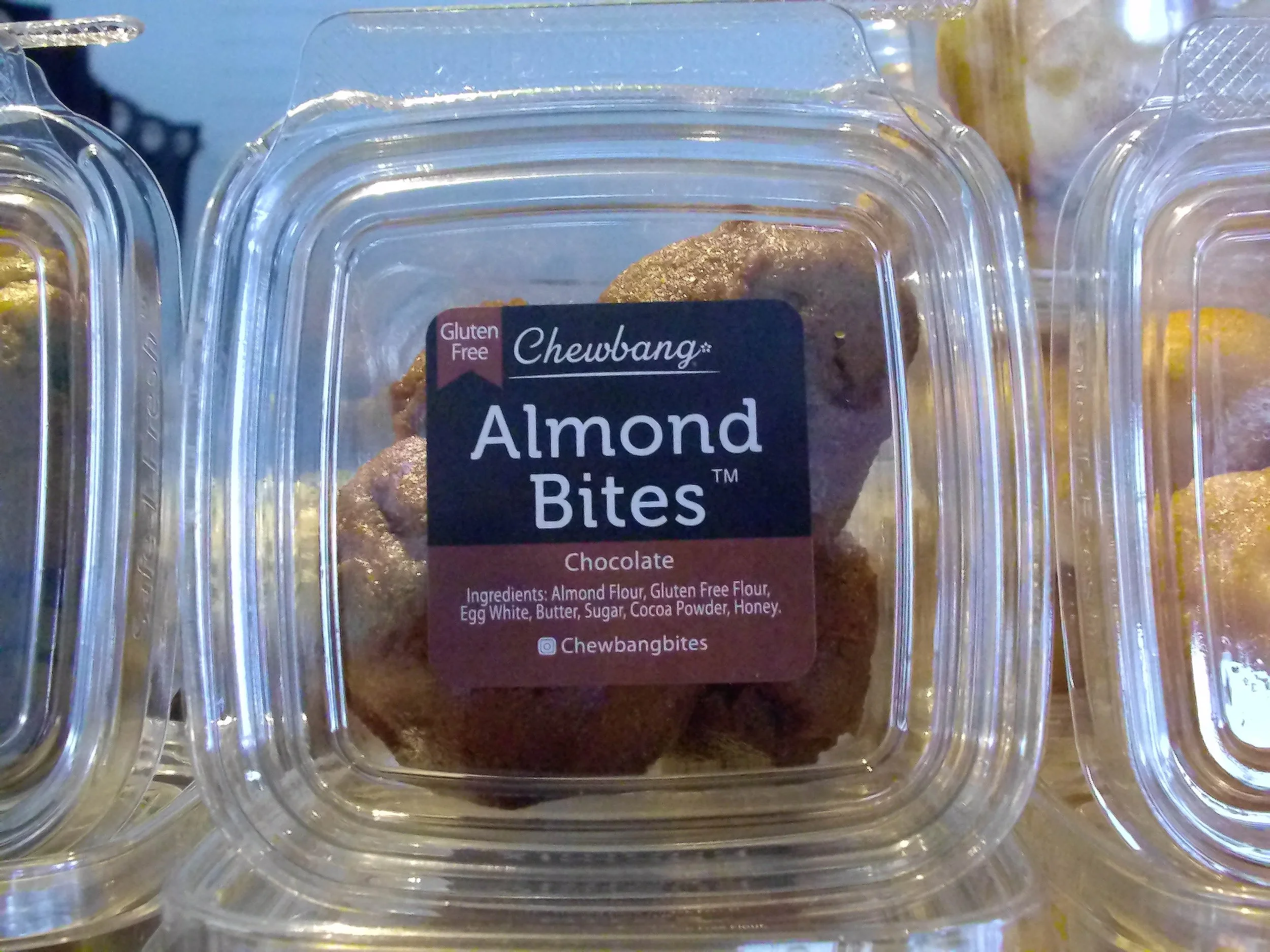 Cafe Ruisseau includes Chewbang “Almond Bites” as a part of their snack selection. Chewbang “Almond Bites” are a sweet snack - a cross between a cookie and an energy bite. They are encased in a small plastic container that holds four “bite” pieces -