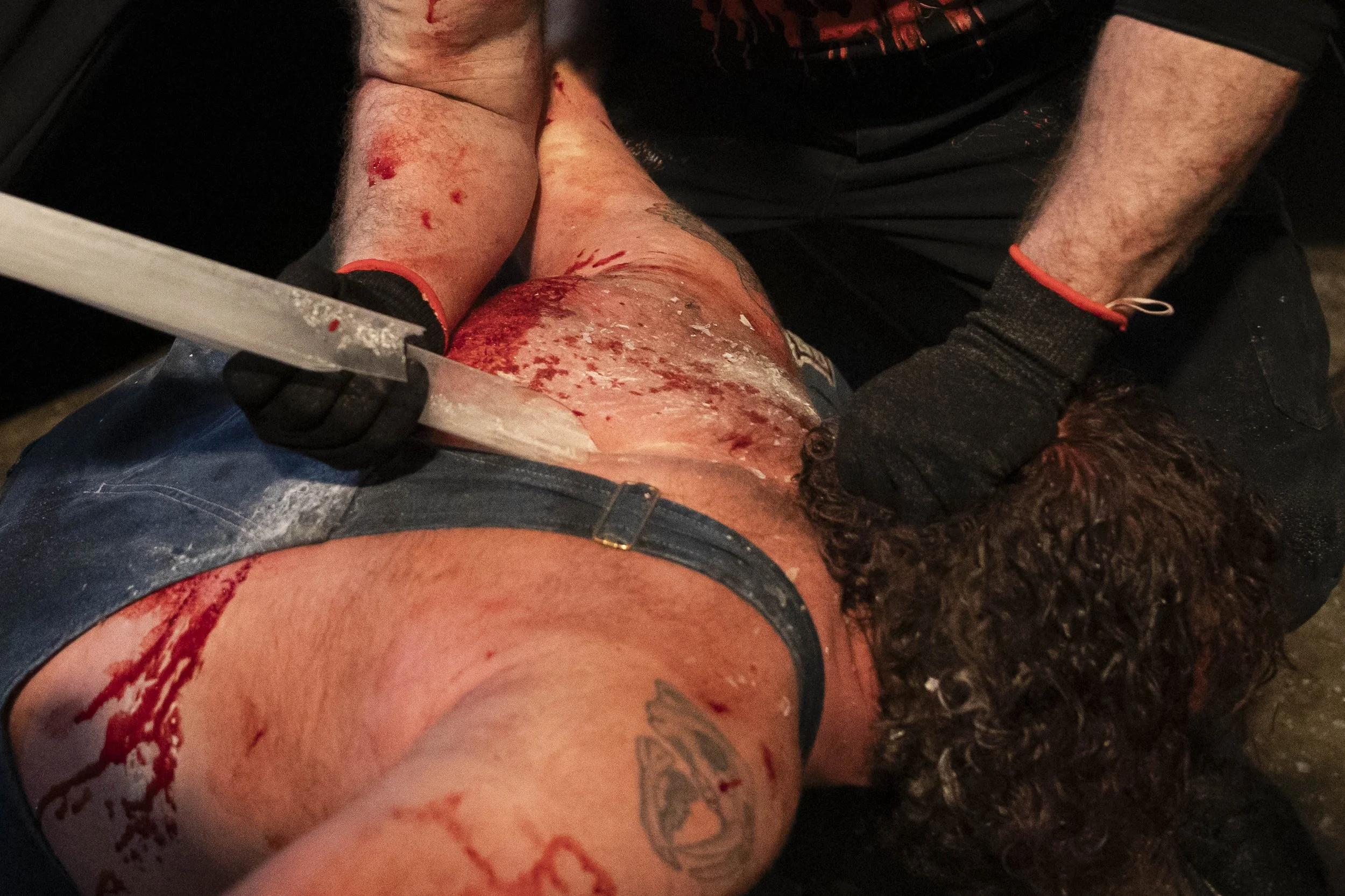  Deathmatch wrestler Phil Insane (C) rakes a broken light tube on Bootleg Dave’s (CB), back inside the LA Church in Los Angeles on Saturday, May 16, 2026, seven months after being told he must medically retire. (Kayjel J. Mairena | The Corsair) 
