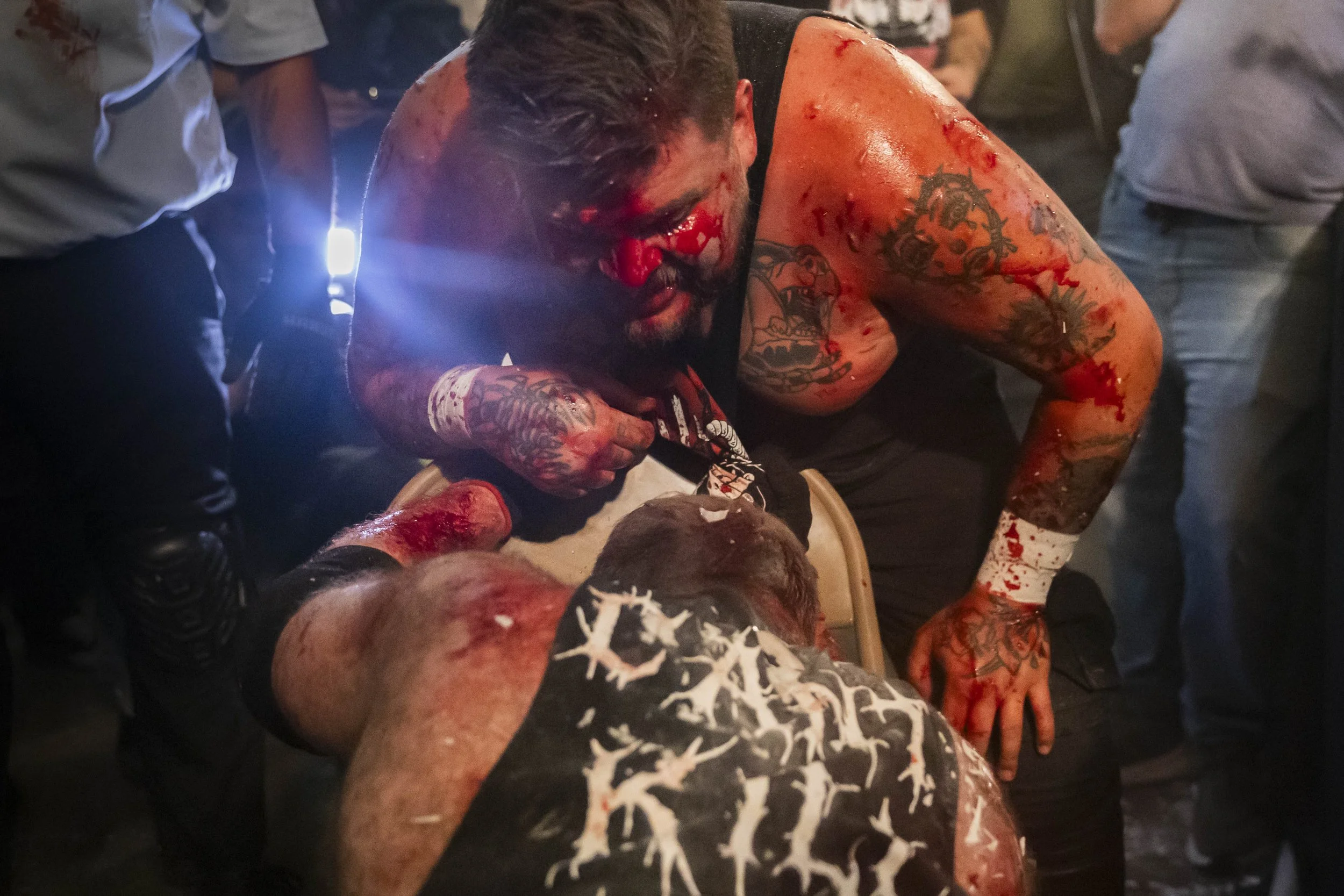  Deathmatch wrestler Joe Dred (C) mocks Phil Insane (CB) as he slowly rises to his feet during a match inside the LA Church in Los Angeles on Saturday, May 16, 2026. (Kayjel J. Mairena | The Corsair) 