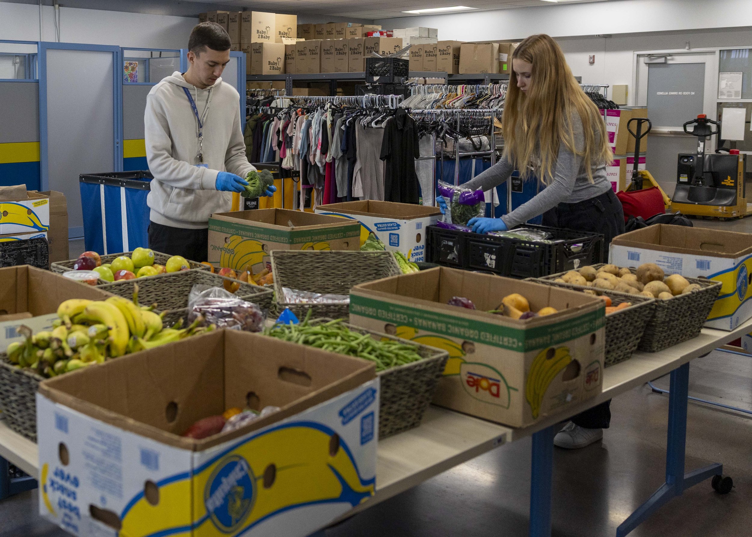  A Santa Monica College student, Natalia Olszewska (R), and Santa Monica College Foundation worker, Alonzo Campos (L), work at the Bodega on the main campus in Santa Monica, Calif., on Tuesday, May 5, 2026. They help when newly delivered items arrive