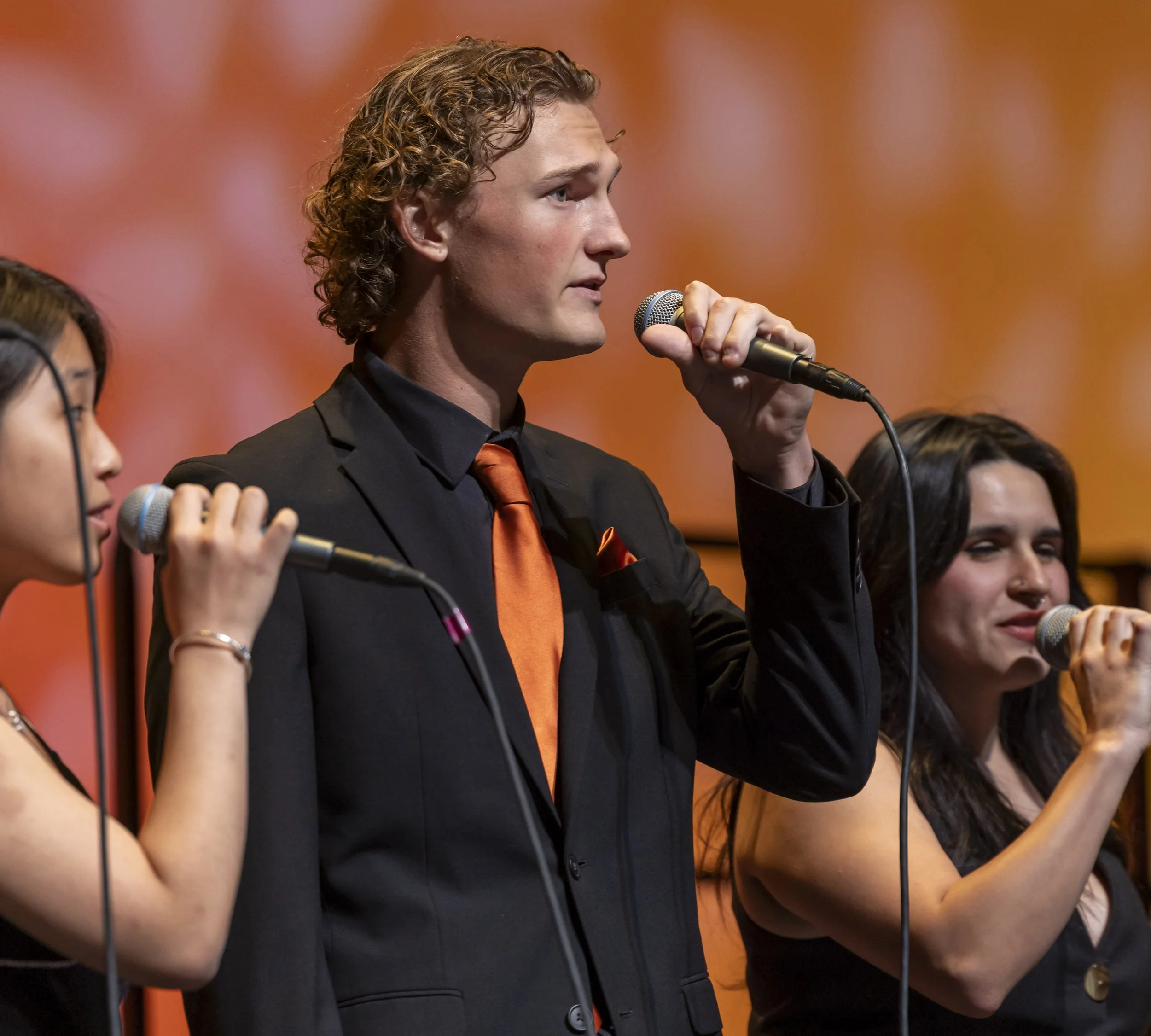  Santa Monica College vocal jazz student Bennett Rackam (center) perform during the Vocal Jazz Ensembles concert at  Broad Stage, Santa Monica College Performing Arts Center, in Santa Monica, on Friday, May 15, 2026. (Masie Najafi | The Corsair) 