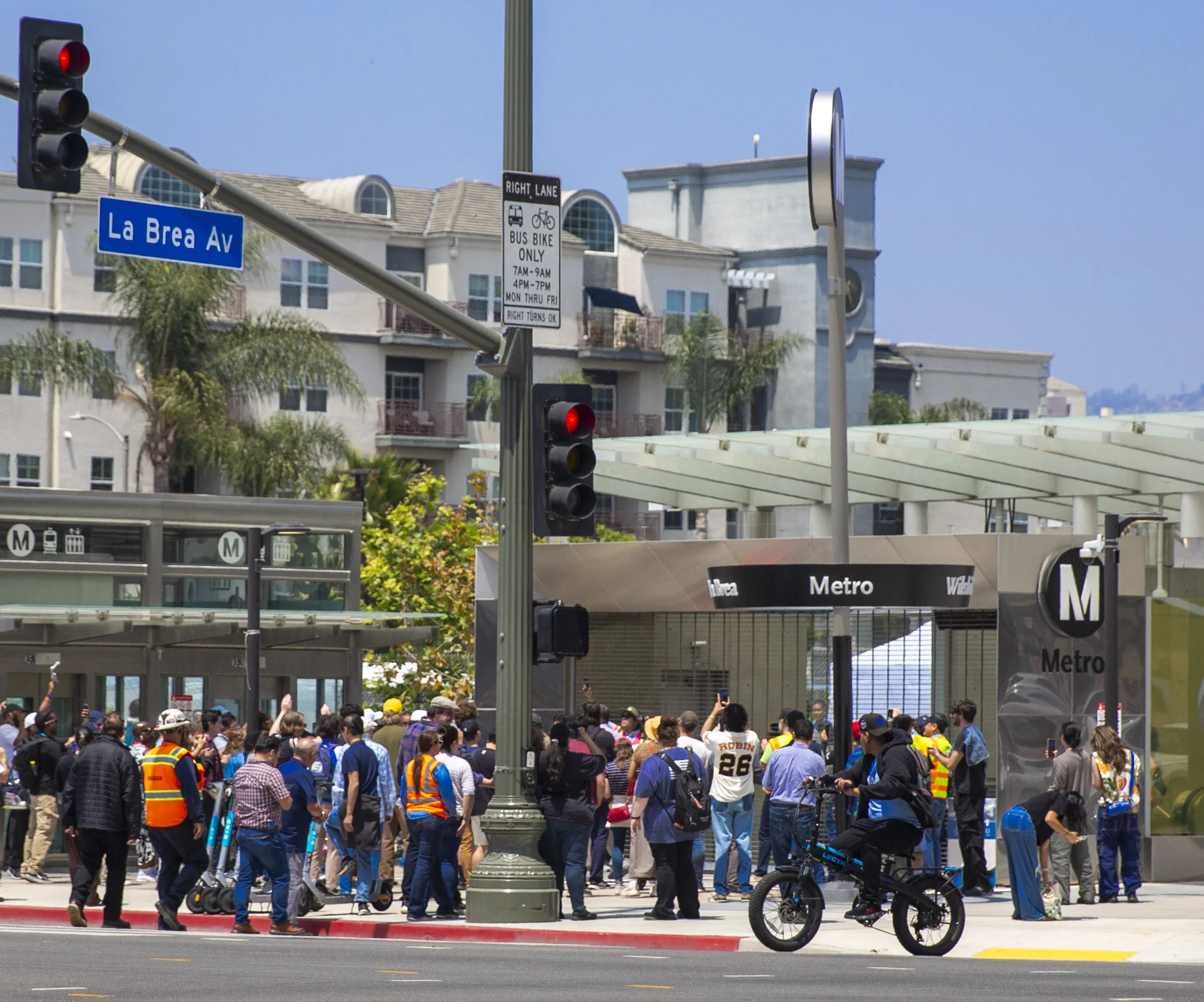  Los Angeles residents gather outside the Wilshire/La Brea Station before the opening of Metro’s D Line Extension Section 1 in Los Angeles on Friday, May 8, 2026. (Jinhao Tian | The Corsair) 
