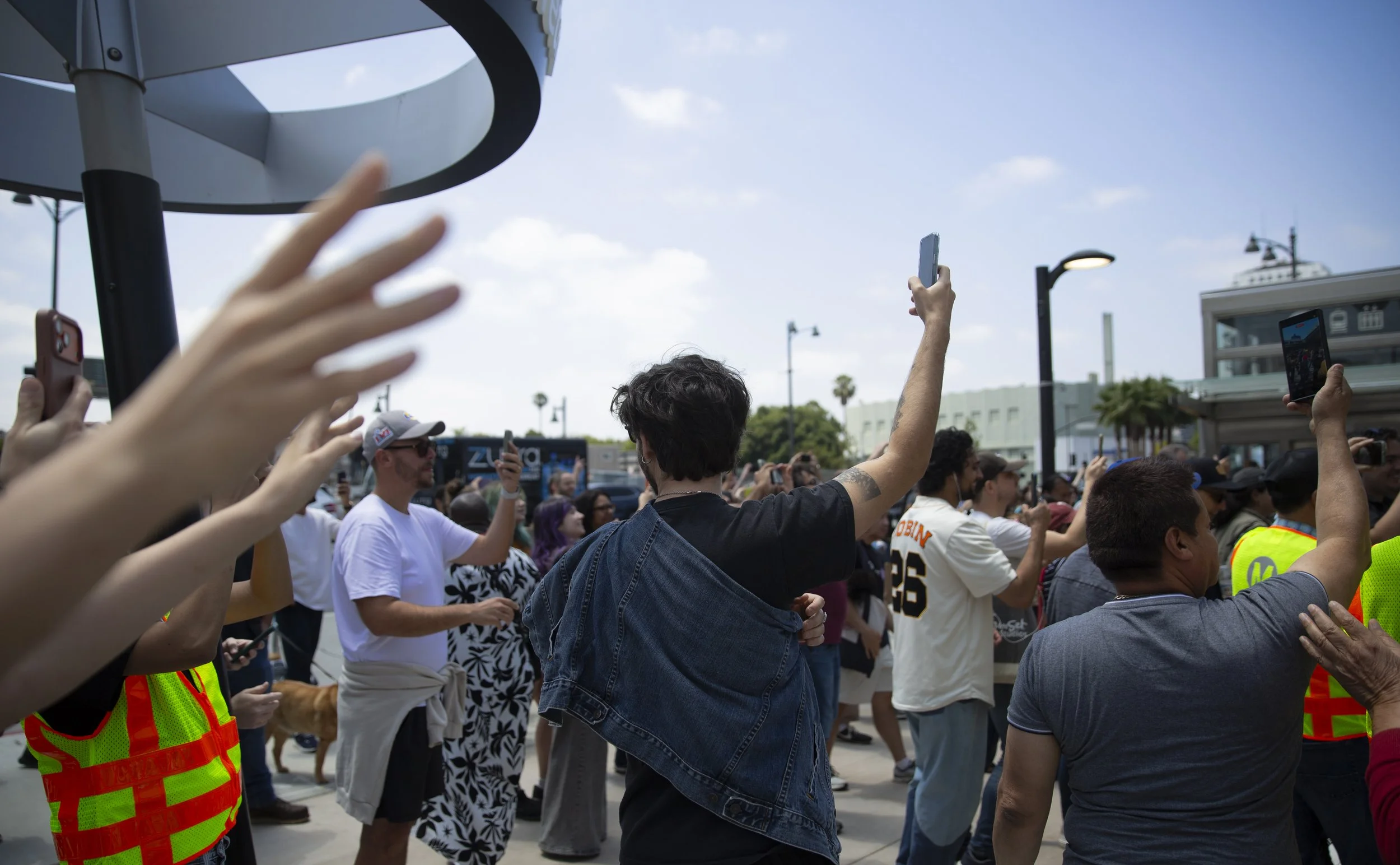  Los Angeles residents gather outside the Wilshire/La Brea Station before the opening of Metro’s D Line Extension Section 1 in Los Angeles on Friday, May 8, 2026. (Jinhao Tian | The Corsair) 