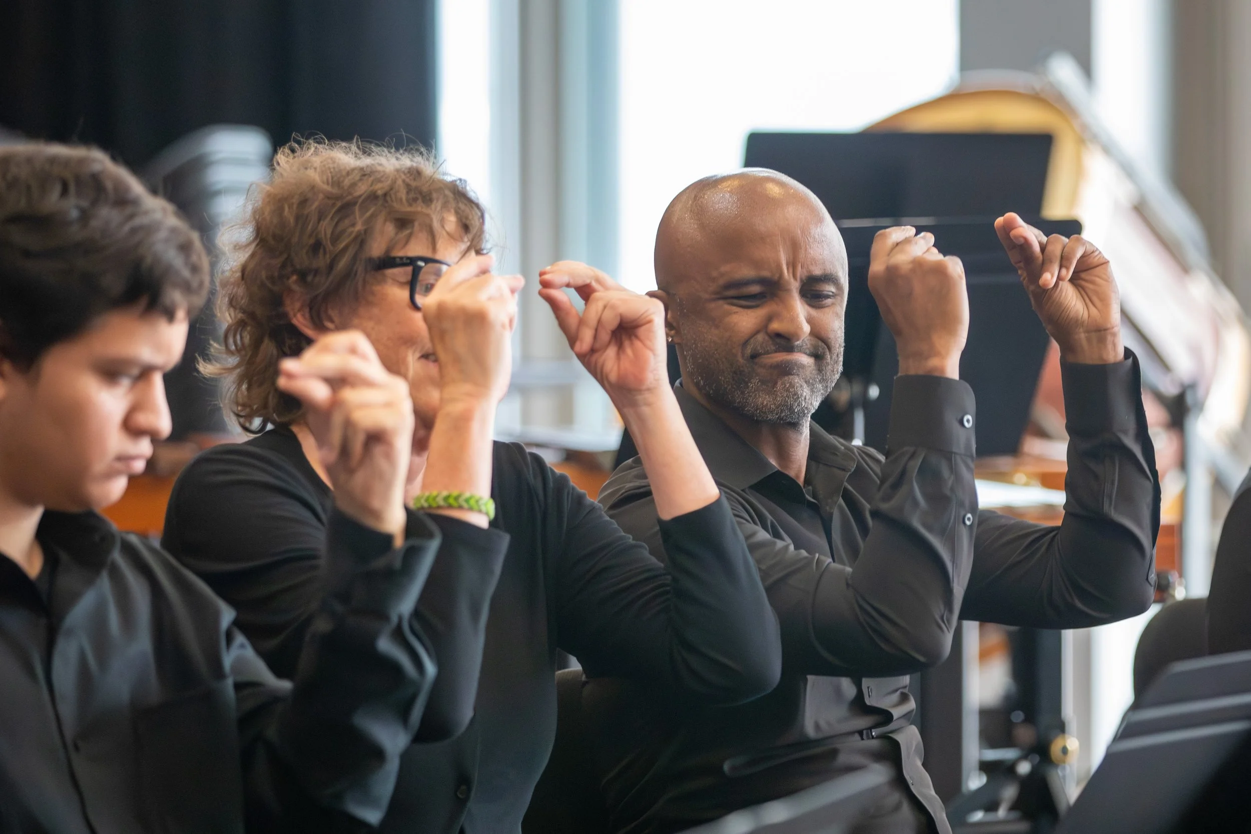  Santa Monica College students Aiden Arenas (left), Wyn Wilson (middle), and Fisseha Asmerom (right) perform on the drums during the SMC Percussion Ensemble concert at the Santa Monica College Performing Arts Center. The show consists of various type