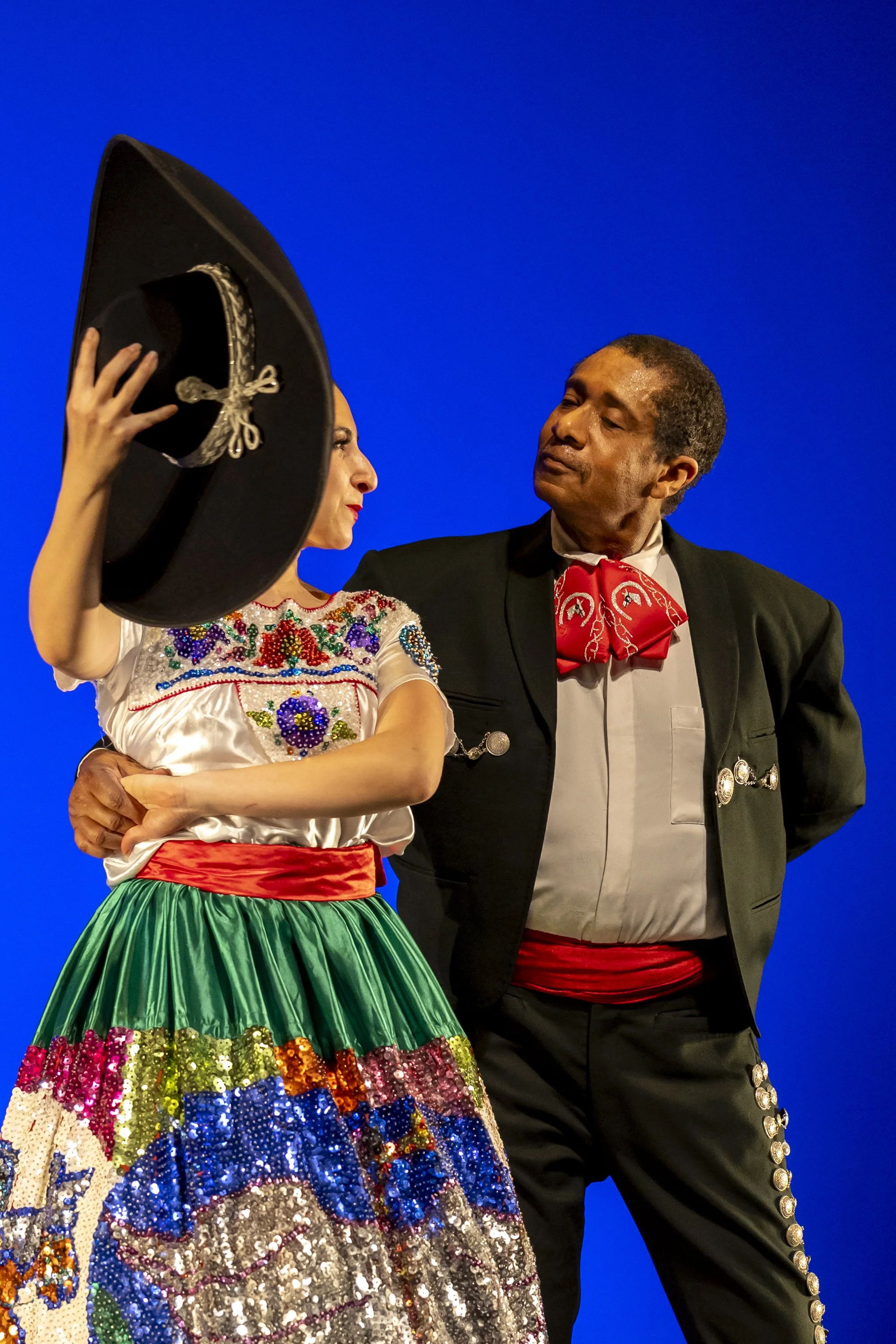  (L-R) Santa Monica College (SMC) World Dance Company dancer X holds the sombrero of company dancer Keith Morris in the mexican performance of ‘Cuadro de Jalisco‘, choreographed by Raquel Ramirez, during a dress rehearsal for the upcoming show ‘Globa