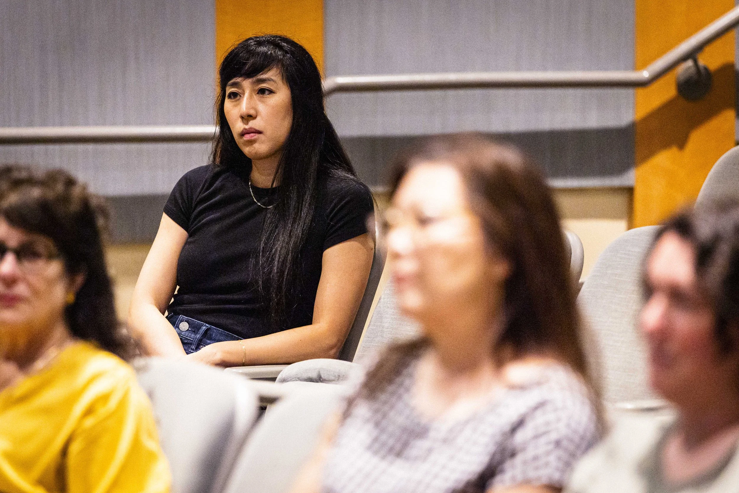  Co-director and Los Angeles Times journalist Rosanna Xia sits among the audience before the screening of her film “Out of Plain Sight,” a documentary about toxic dumping grounds off the coast of Southern California, in the Humanities & Social Scienc