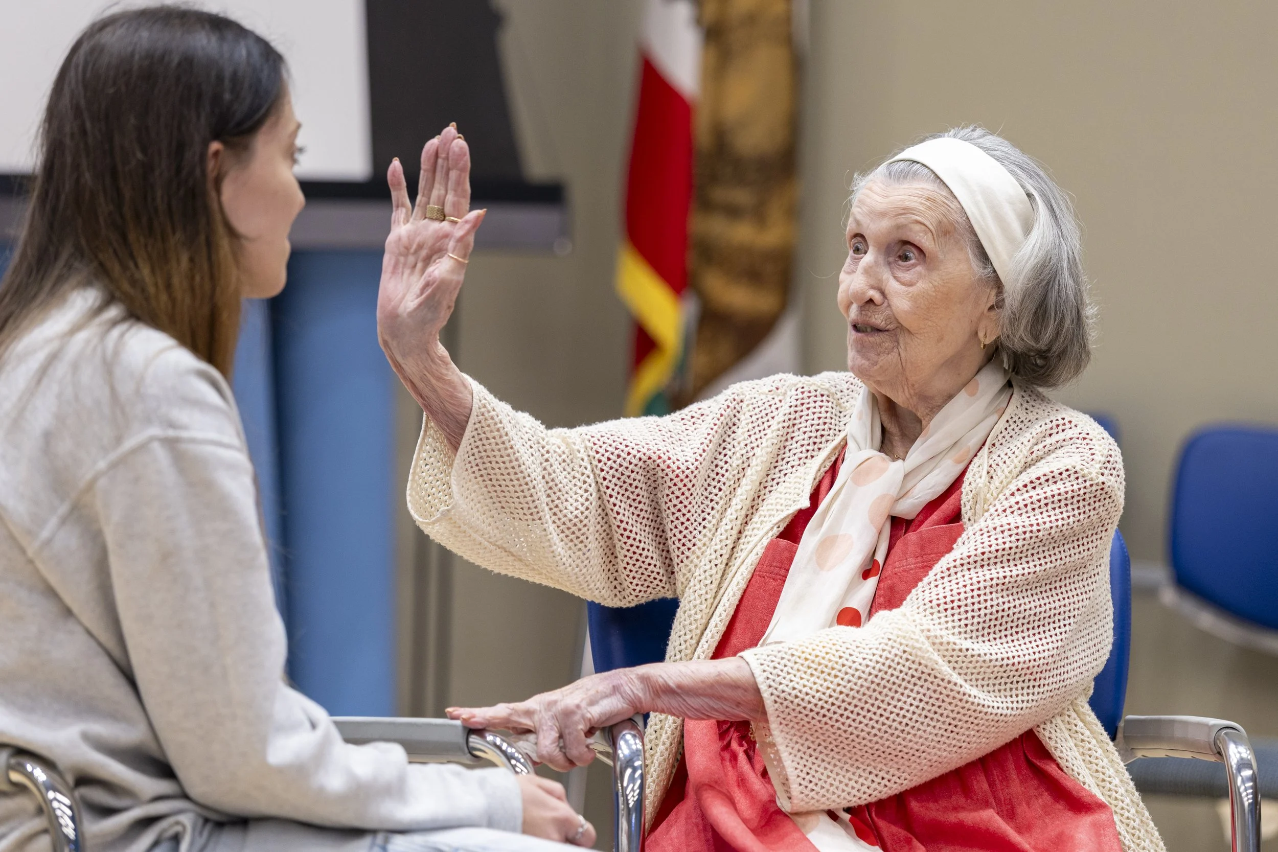  (L-R) Santa Monica College (SMC) student Klaudia Koza, a Computer Science major, listens to Holocaust survivor Mary Bauer, nearly 99 years old, during a one-on-one conversation after the event ‘A Conversation with Holocaust Survivor Mary Bauer’ on T