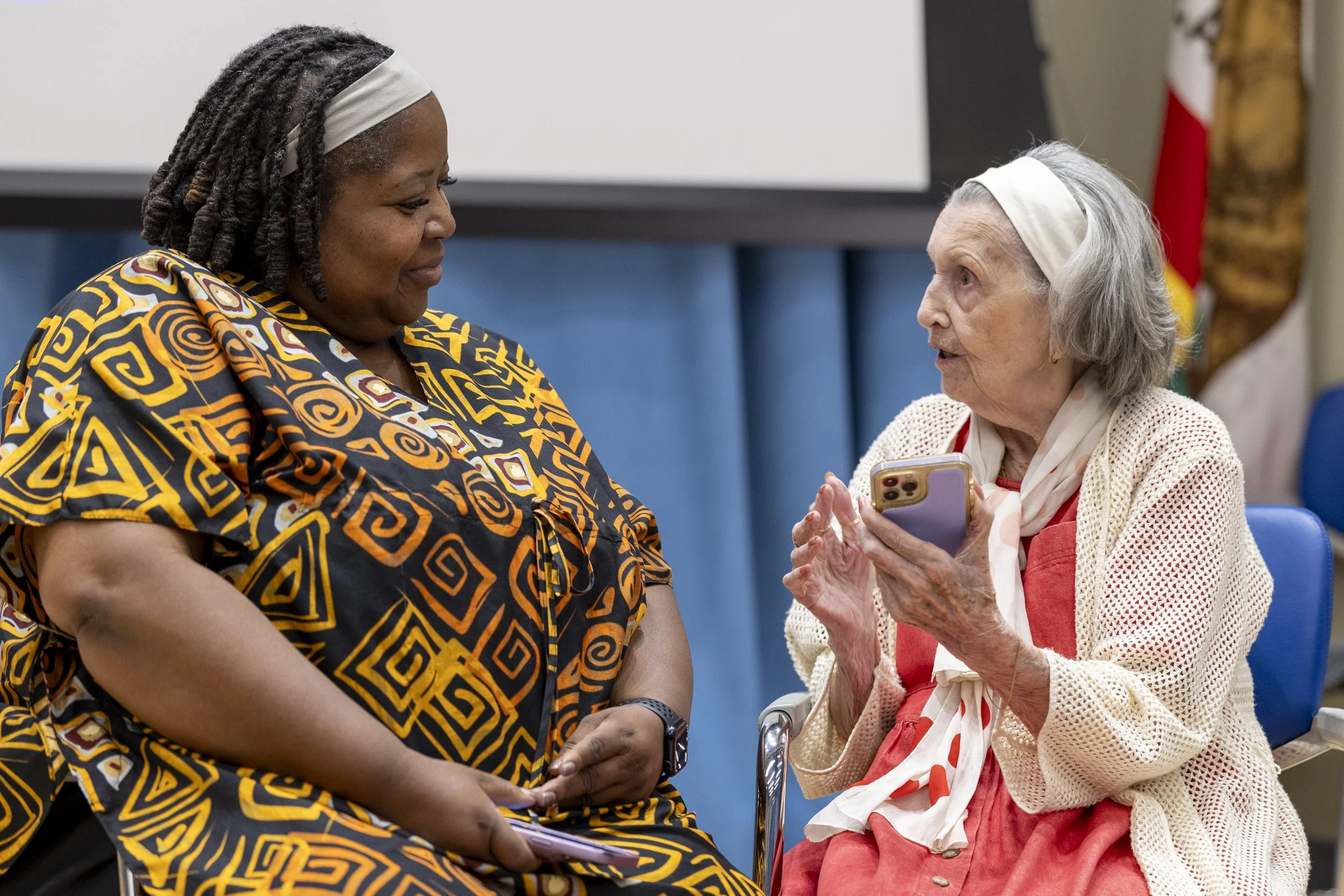  (L-R) Redelia Shaw, Santa Monica College (SMC) Chair of Communication, listens to Mary Bauer, a nearly 99-year-old Holocaust survivor, during a one-on-one conversation after the event ‘A Conversation with Holocaust Survivor Mary Bauer’ on Thursday, 