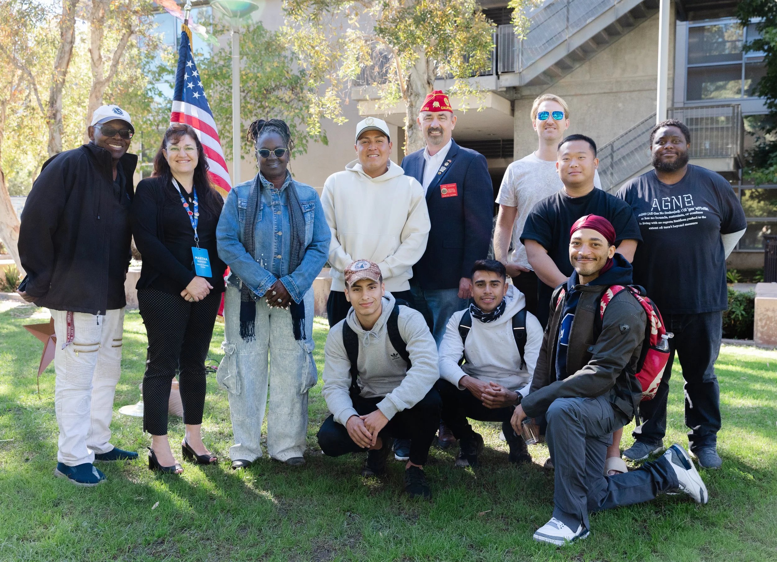  Attendees of the Santa Monica College Veterans Day Ceremony pose with guest speaker Jere Romano on November 7, 2024 at Santa Monica College, Santa Monica, Calif. Jere Romano is a National Executive Committeeman for the American Legion and retired Sa
