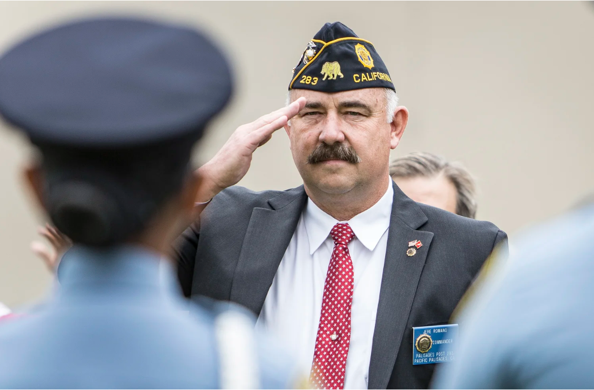  Santa Monica College Police Sergeant Jere Romano salutes for honor fallen veterans at the 79th Annual Memorial Day Observance at Woodlawn Cemetery in Santa Monica, CA, Monday, May 29, 2017. (Daniel Bowyer | The Corsair)  
