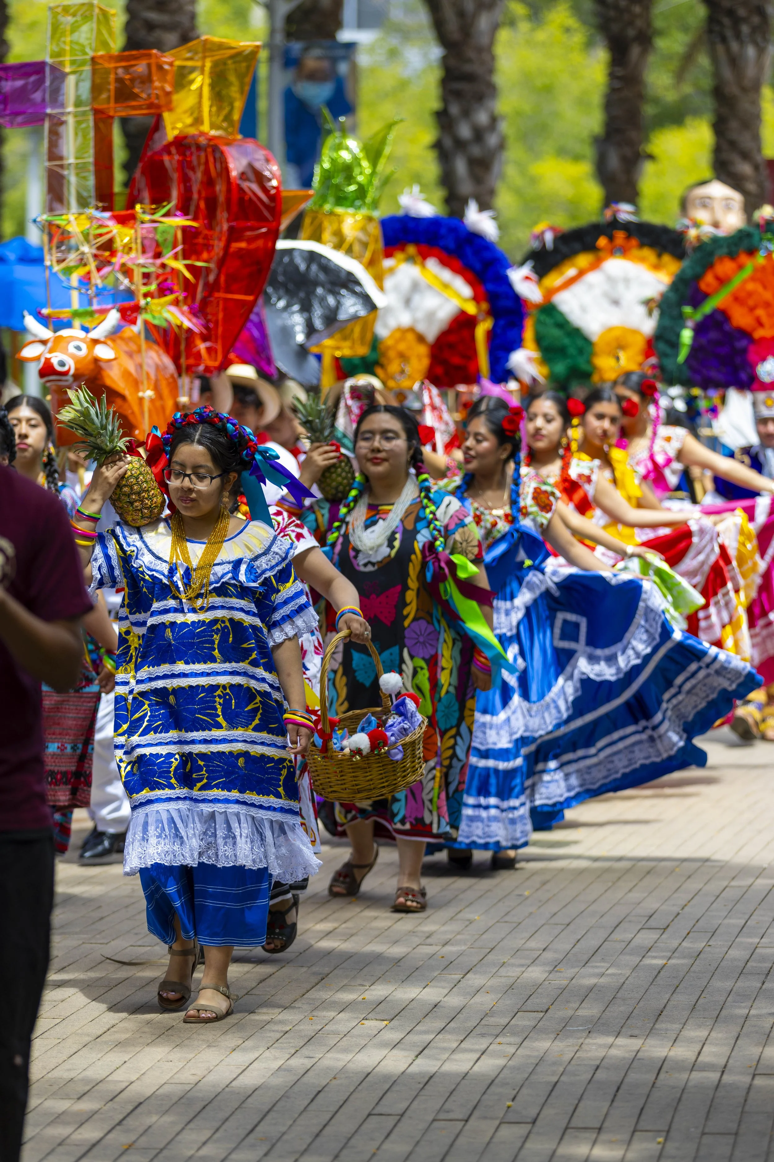  Oaxacans at Santa Monica College (SMC) members carrying Pineapples and Toritos (paper-mâché little bull) as they are dancing to a live Banda (band) during the Guelaguetza held at the Main Quad, SMC, Santa Monica, Calif, on Thursday, May 28, 2026. Th