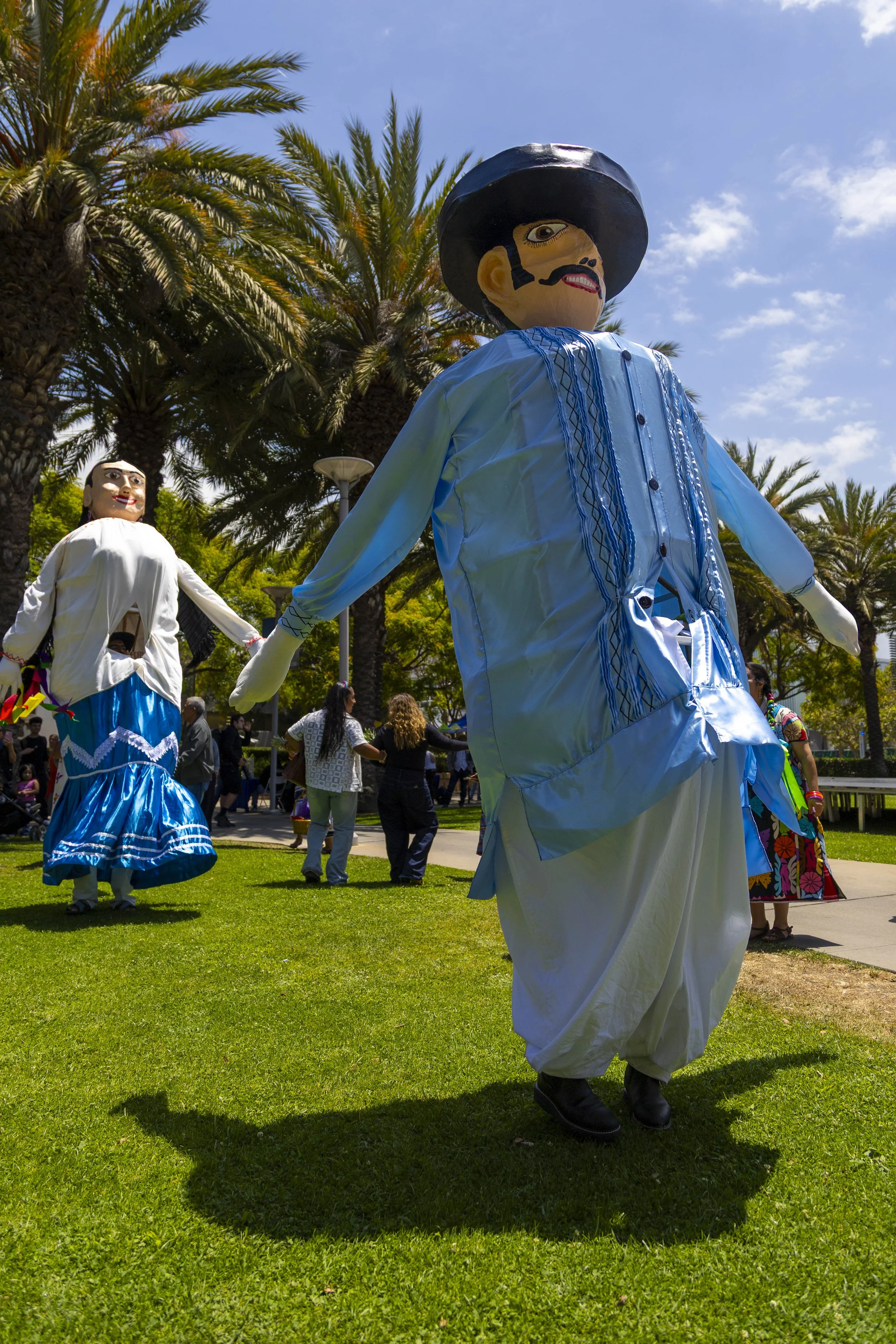  Two mojigangas dancing to live music during the Guelaguetza with Guelaguetza-goers at the Main Quad, SMC, Santa Monica, Calif, on Thursday, May 28, 2026. The Guelaguetza is a traditional celebration held in the state of Oaxaca, Mexico, in the month 