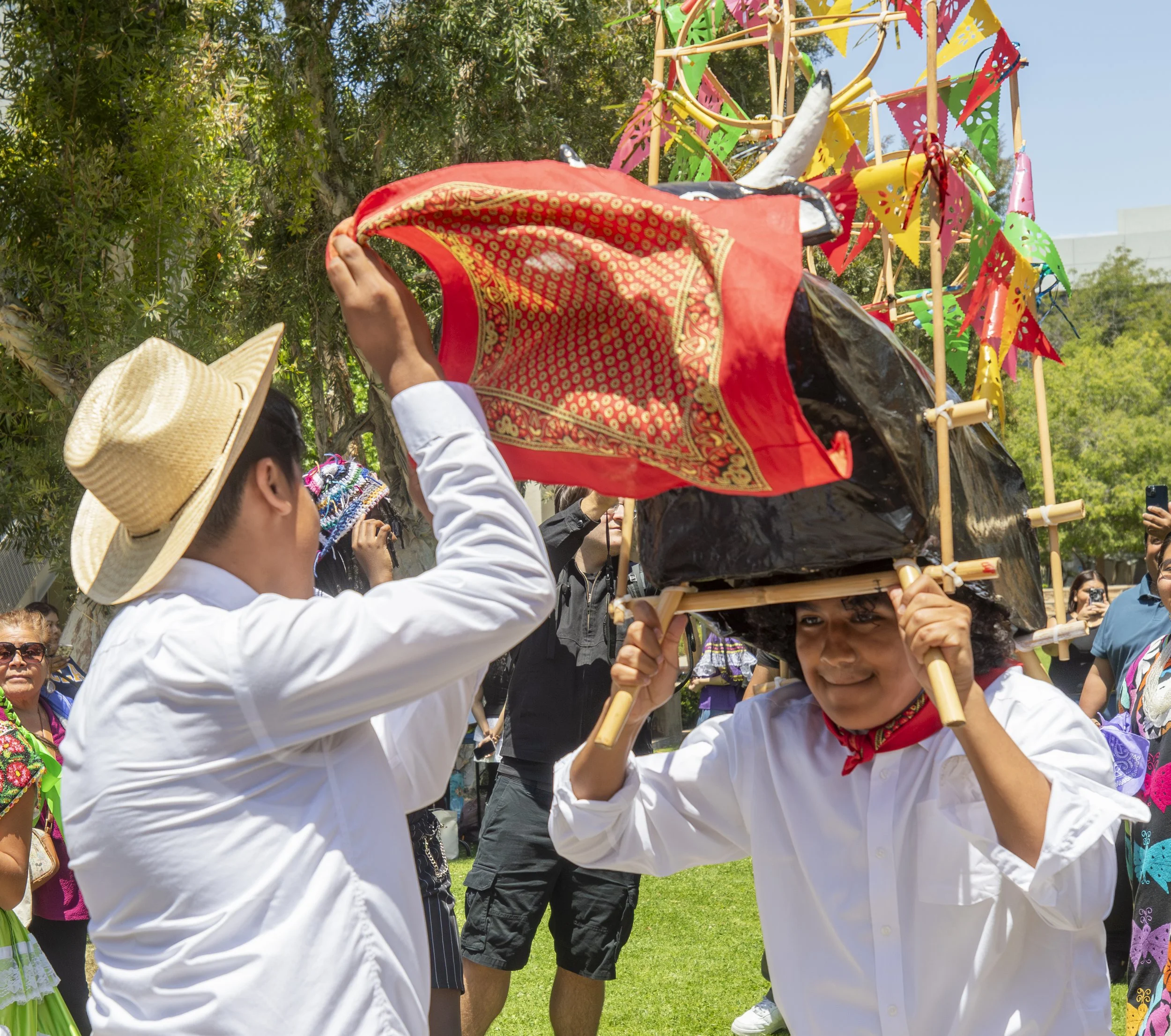  Students from the Oaxacans of Santa Monica College (SMC) Club dance with a bull and red scarf at the Guelaguetza 2026 celebration on the SMC main campus in Santa Monica, Calif. on Thursday, May 28th, 2026. The celebration is a traditional Oaxacan ev