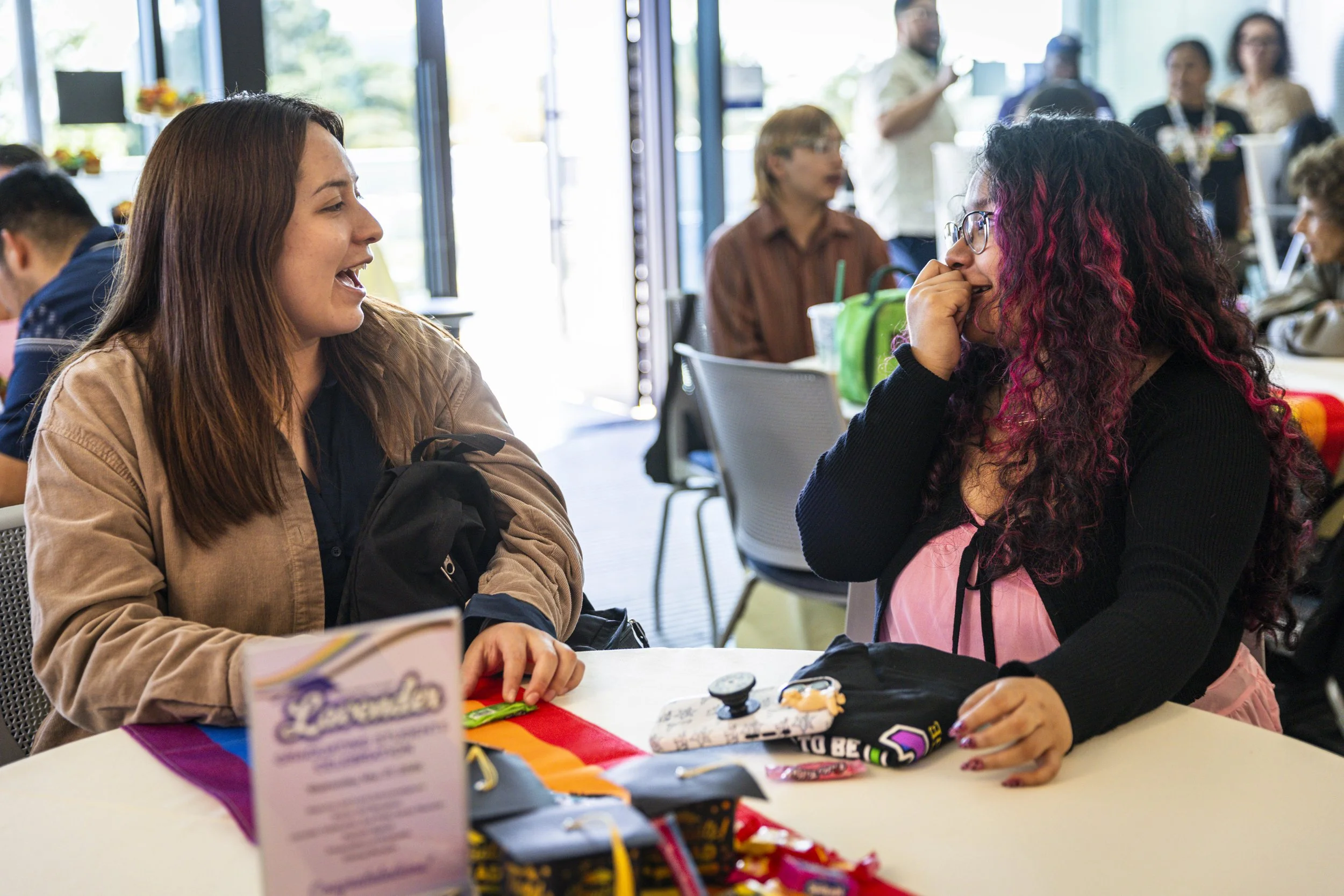  New Santa Monica College (SMC) graduates Keily Acuna-Tomas (R) and Christie Rojas-Sapon (L) during the Student Equity Center celebration for LGBTQIA2S+ graduates from the Class of 2026 on Wednesday, May 27, 2026, in the Student Services Center’s Fac