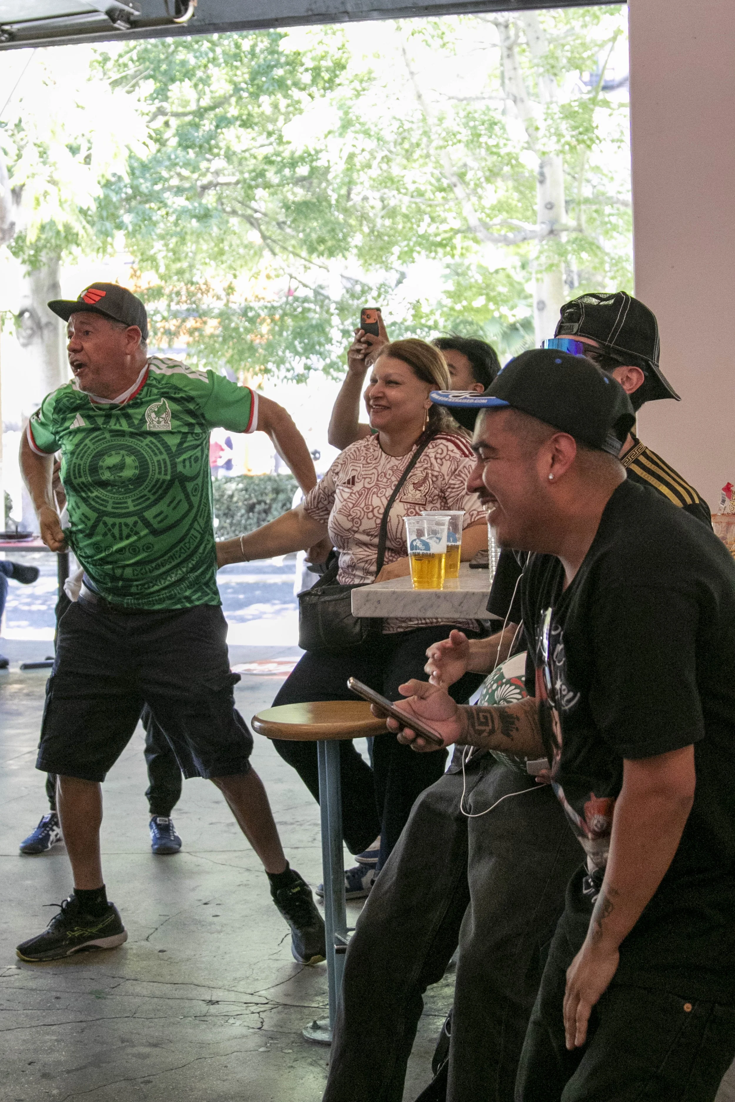  Mexico Soccer Fans cheering as Mexico striker Raul Jimenez scores the second goal for Mexico during the inaugural match of the 2026 Fédération Internationale de Football Association (FIFA) World Cup at the Grand Central Market, Downtown Los Angeles,