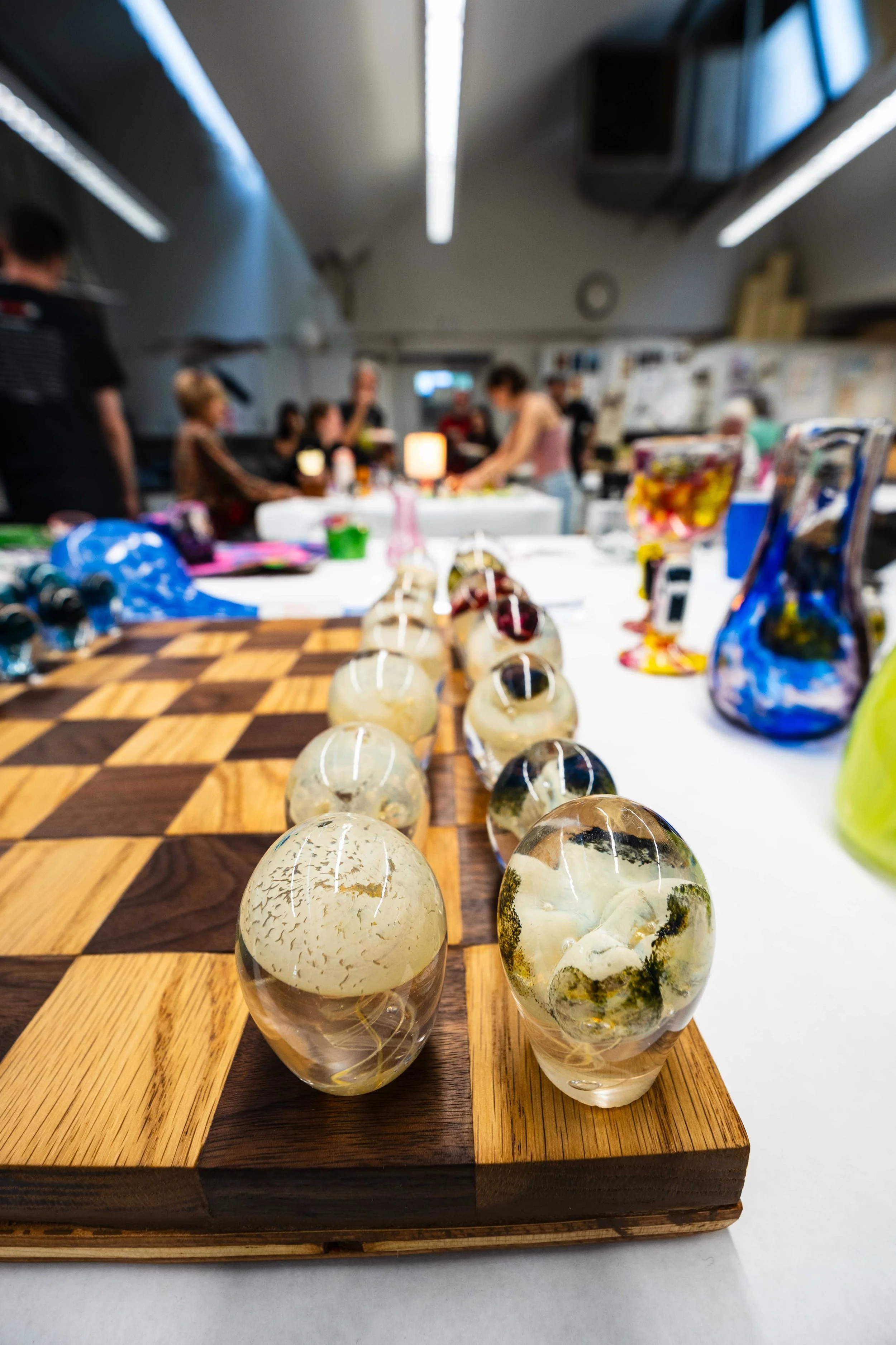  Jellyfish themed chess pieces by Santa Monica College (SMC) student Julian Bender, while glass sculpture students mingle for the first hour of their final before giving individual presentations inside the glass studio at the SMC Art Complex in Santa