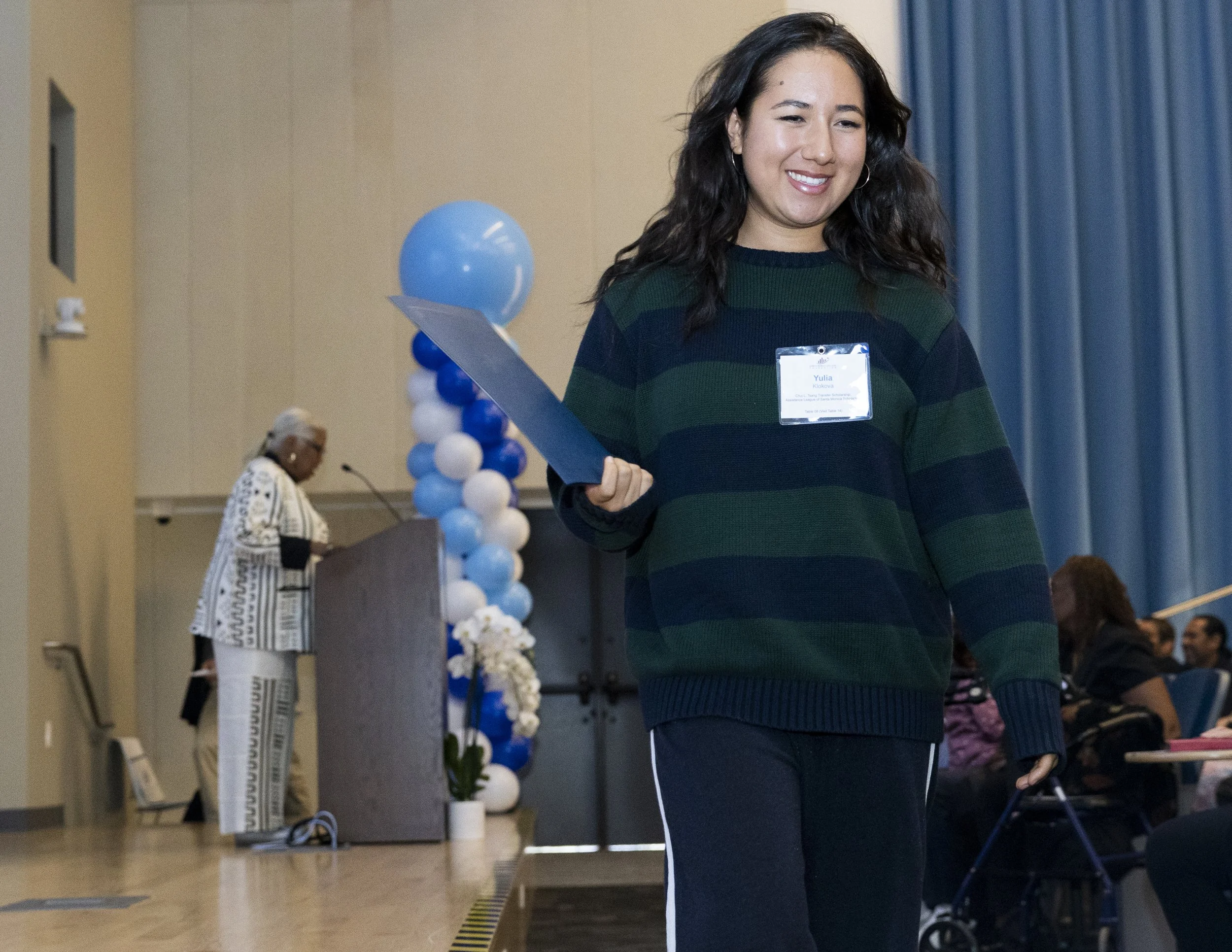  Santa Monica College President and Superintendent Kathryn Jeffery (L) speaks to the crowd at the college’s  scholarship and donor recognition event inside the Student Services Center in Santa Monica, Calif., on Friday, June 12, 2026, while scholarsh