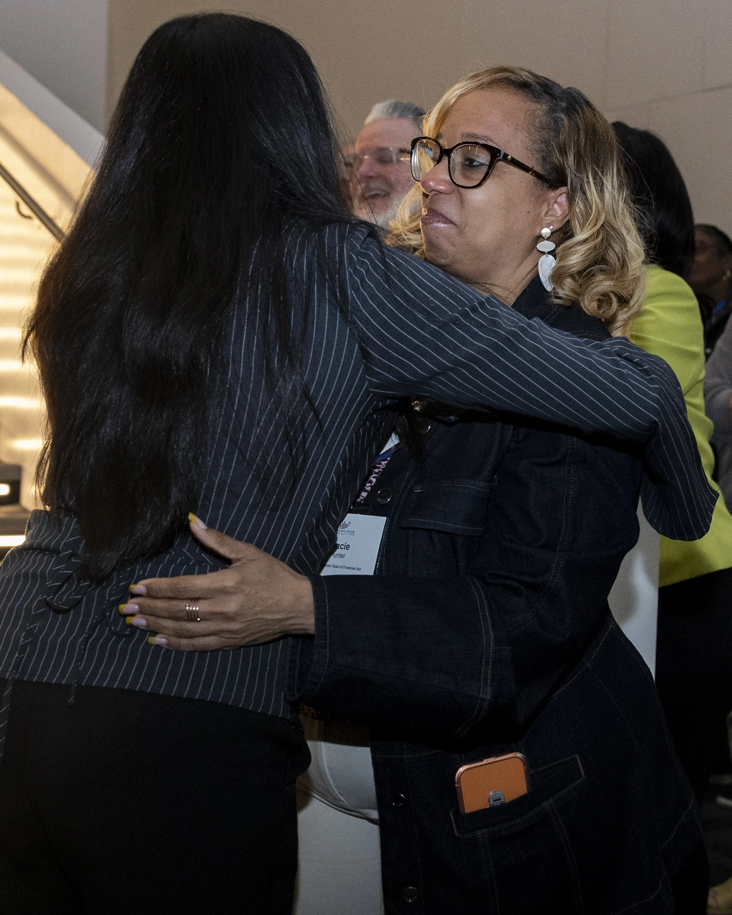  Santa Monica college student Aye Hwte hugs the college’s associate dean of financial aid and scholarships, Tracie Hunter, during the college’s scholarship and donor recognition event inside the Student Services Center in Santa Monica, Calif., on Fri