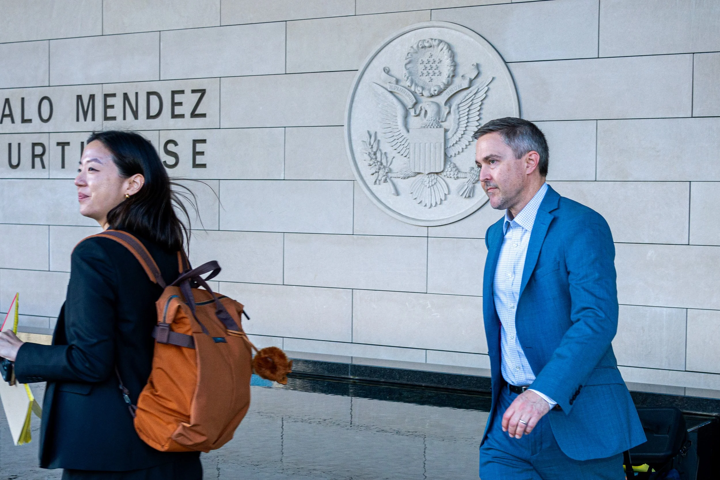  Danbee C. Kim, assistant U.S. attorney for the Central District of California (left), and Mark Williams, chief of the Environmental Crimes and Consumer Protection Section at the U.S. Department of Justice (right), walk out of the Felicitas and Gonza