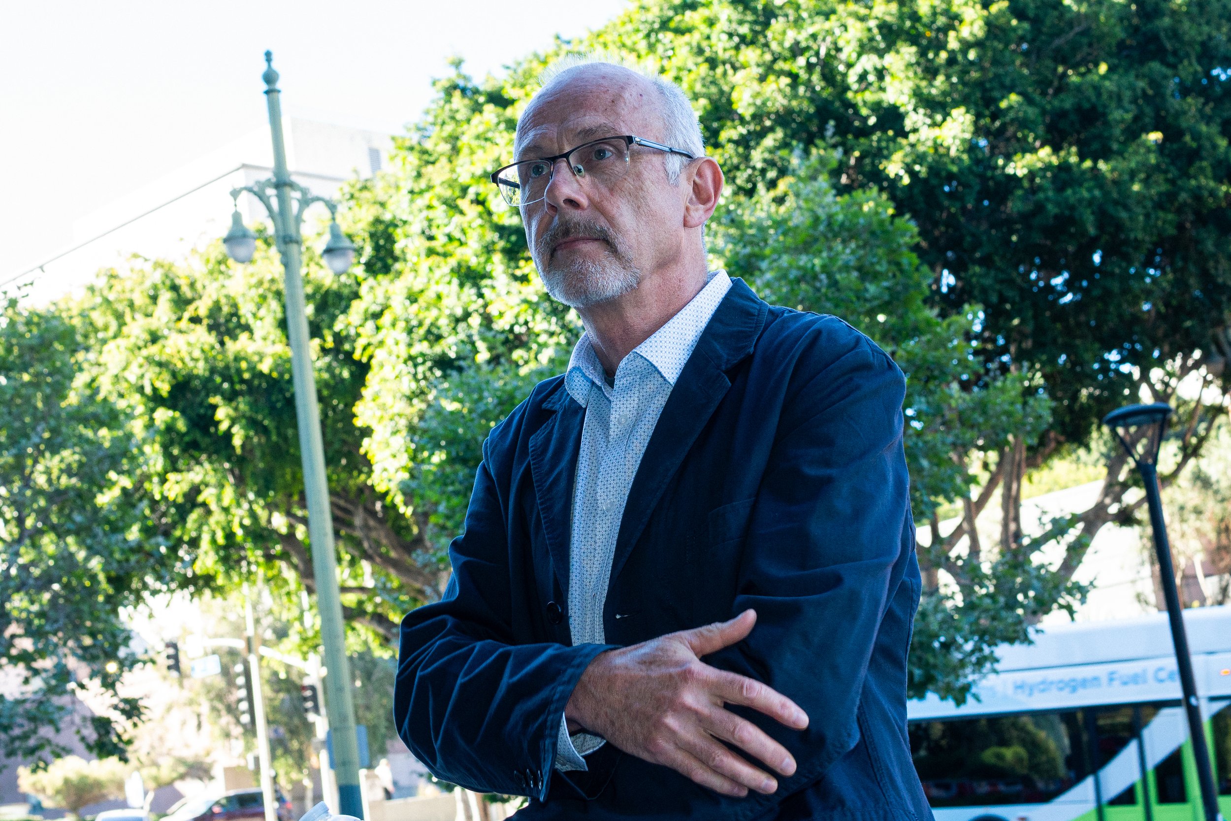  Joel Rinderknecht, the father of accused arsonist Jonathan Rinderknecht, stands in front of the Felicitas and Gonzalo Mendez United States Courthouse with his son’s defense team, Monday, June 22, in downtown Los Angeles. (Nathan Hanson | The Corsair