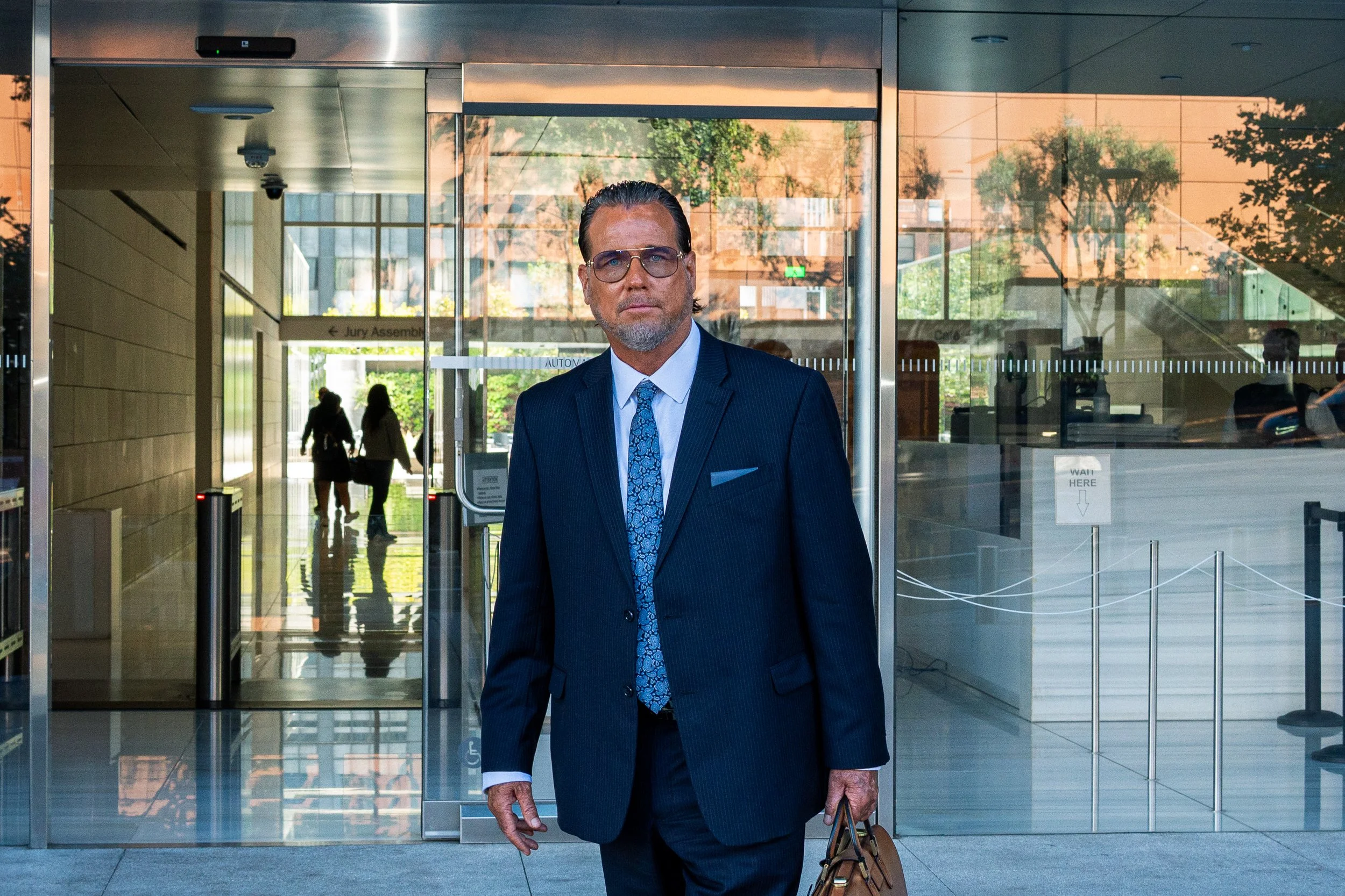  Steve Haney, the defense attorney for Jonathan Rinderknecht, stands in front of the Felicitas and Gonzalo Mendez United States Courthouse, Monday, June 22, in downtown Los Angeles. Rinderknecht was accused by the Department of Justice of three felon