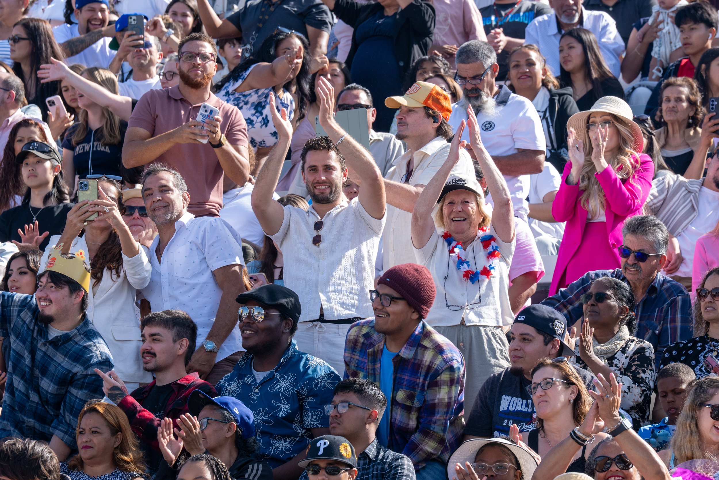  Family and freinds waving and taking pictures of their graduates at the Santa Monica College (SMC) 2026 Graduation Ceremony at the Corsair Stadium, Santa Monica, Calif., on Tuesday, June 16, 2026. (Tom Rosholt | The Corsair) 