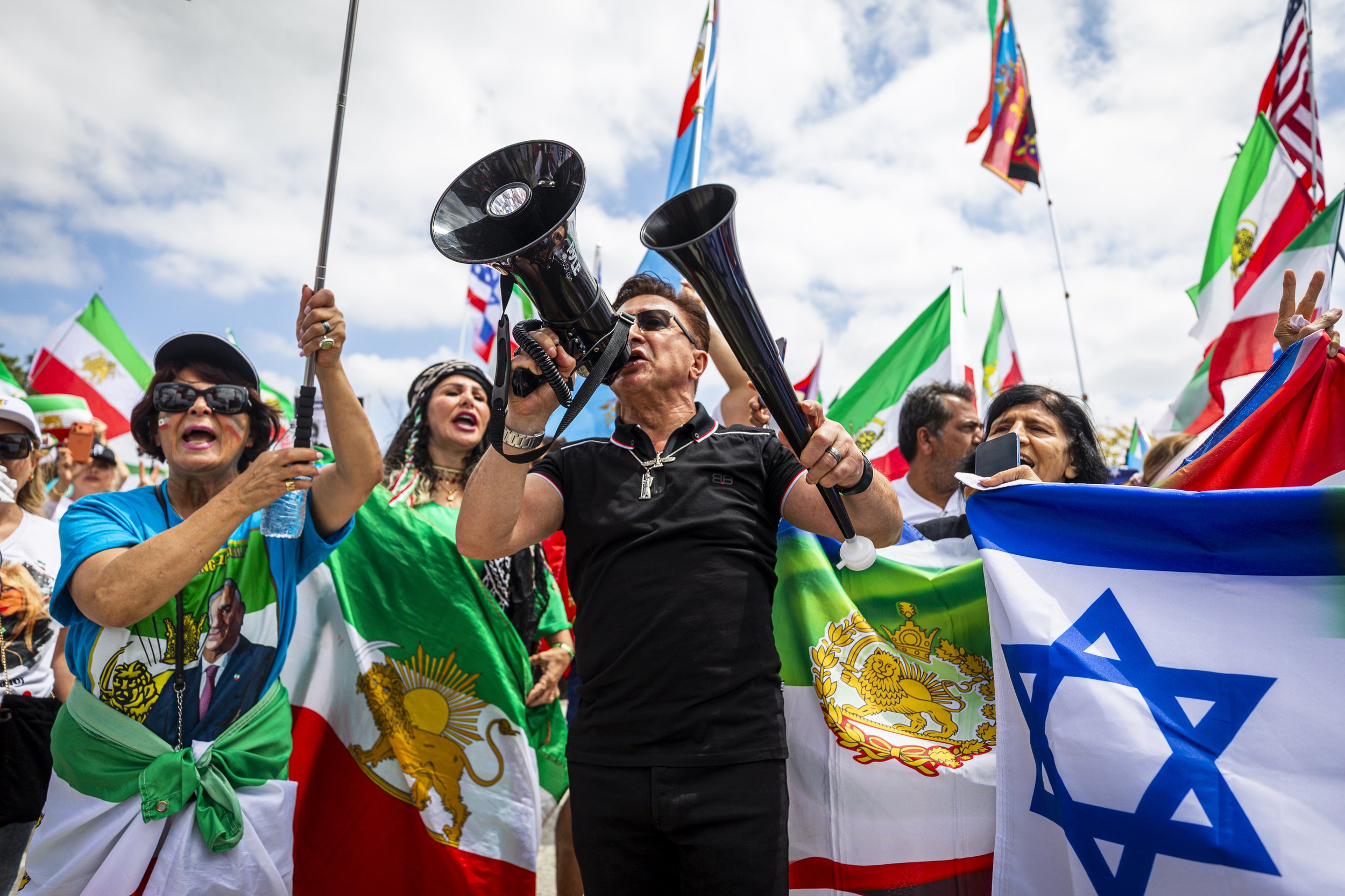  Protesters opposed to Iran’s current government gather outside SofFi Stadium before the FIFA World Cup match between Iran and Belgium on Sunday, June 21st, 2026, in Inglewood, Calif. Iran’s pre-1979 national flag with the Lion and Sun emblem, along 