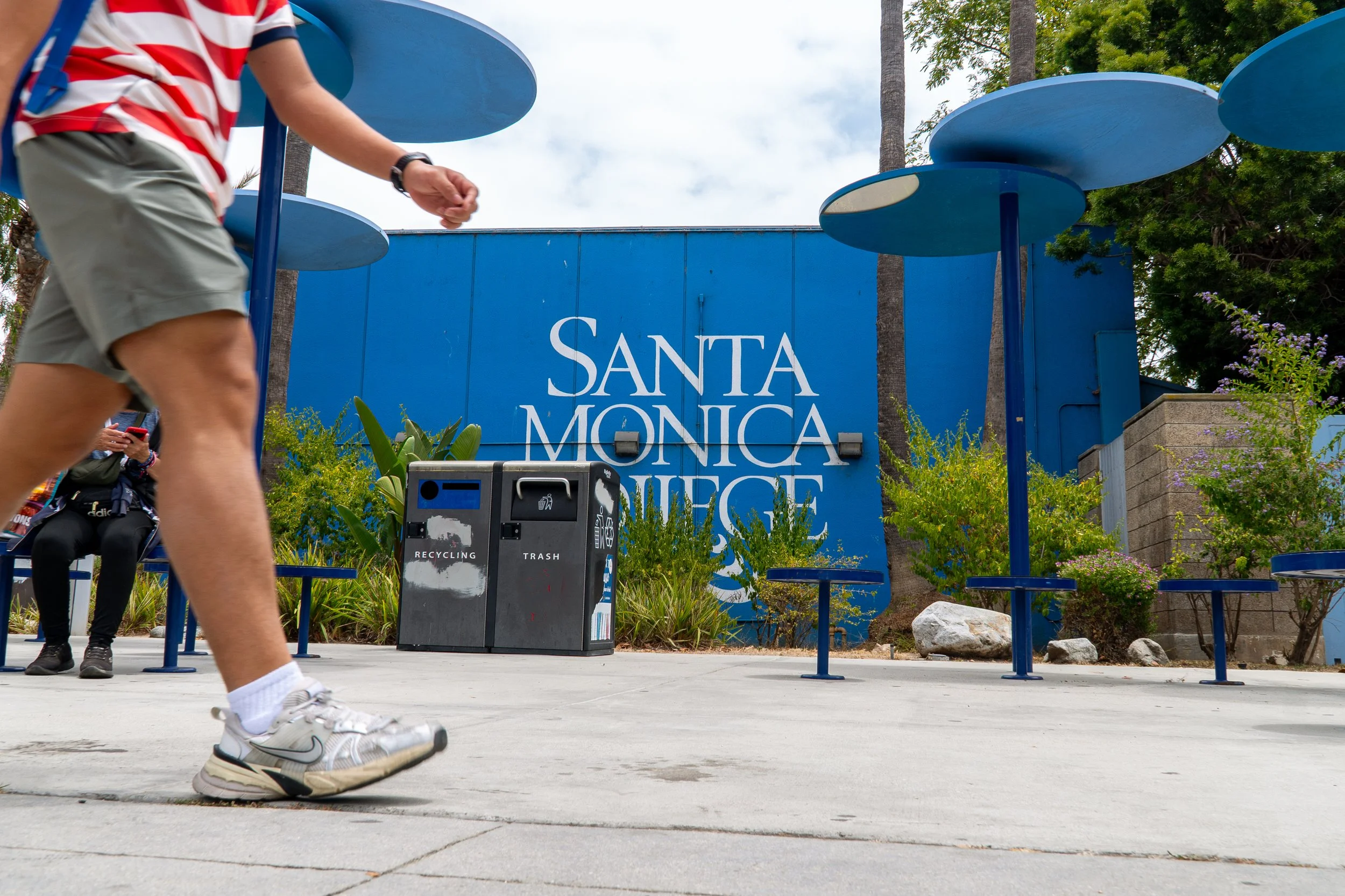  Pedestrians near the Santa Monica College (SMC) campus walk by the outside premises, Wednesday, July 1, in Santa Monica, Calif. (Nathan Hanson | The Corsair) 