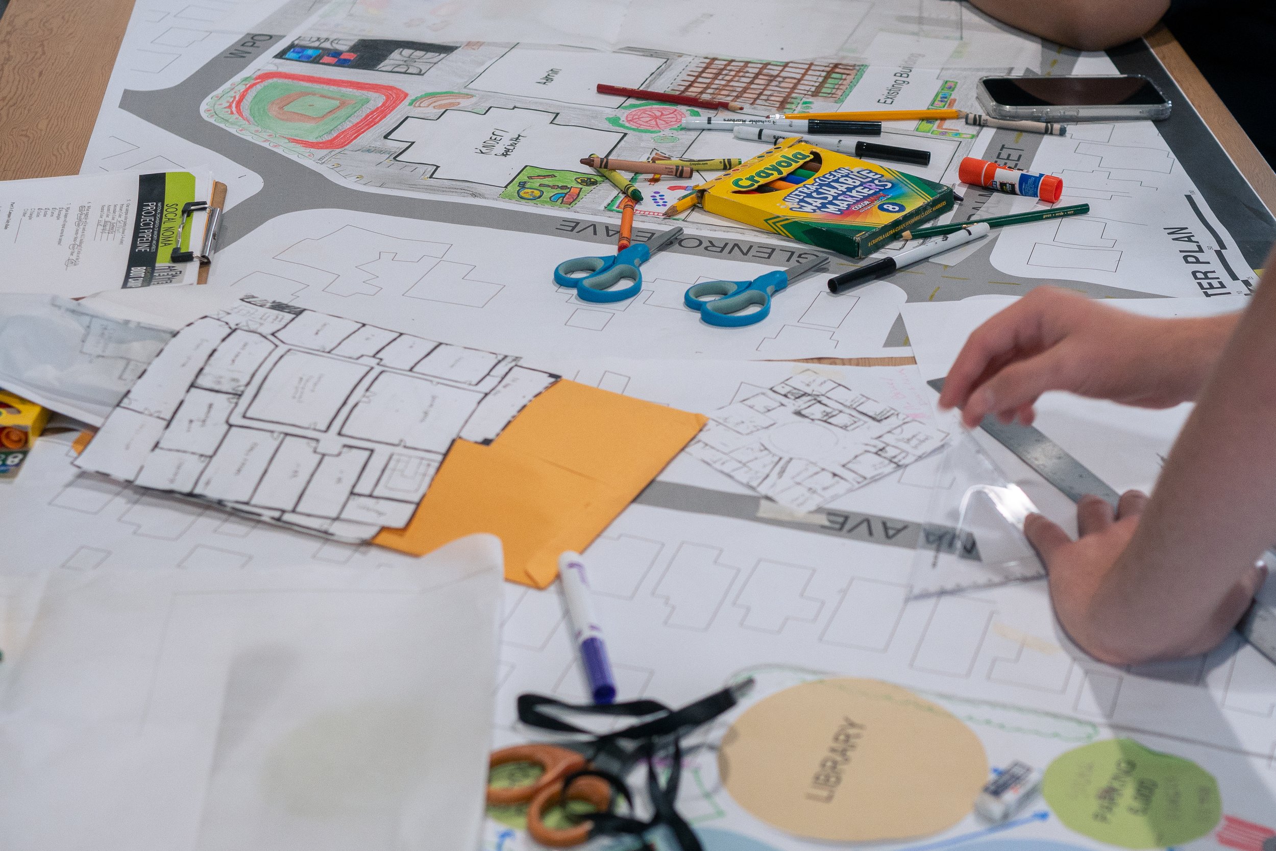  Students collaborate on a community design layout using tracing paper and color-coded bubble diagrams during SoCal NOMA's annual Architecture Boot Camp at Santa Monica College's Center for Media and Design,  Friday, July 24, in Santa Monica, Calif. 