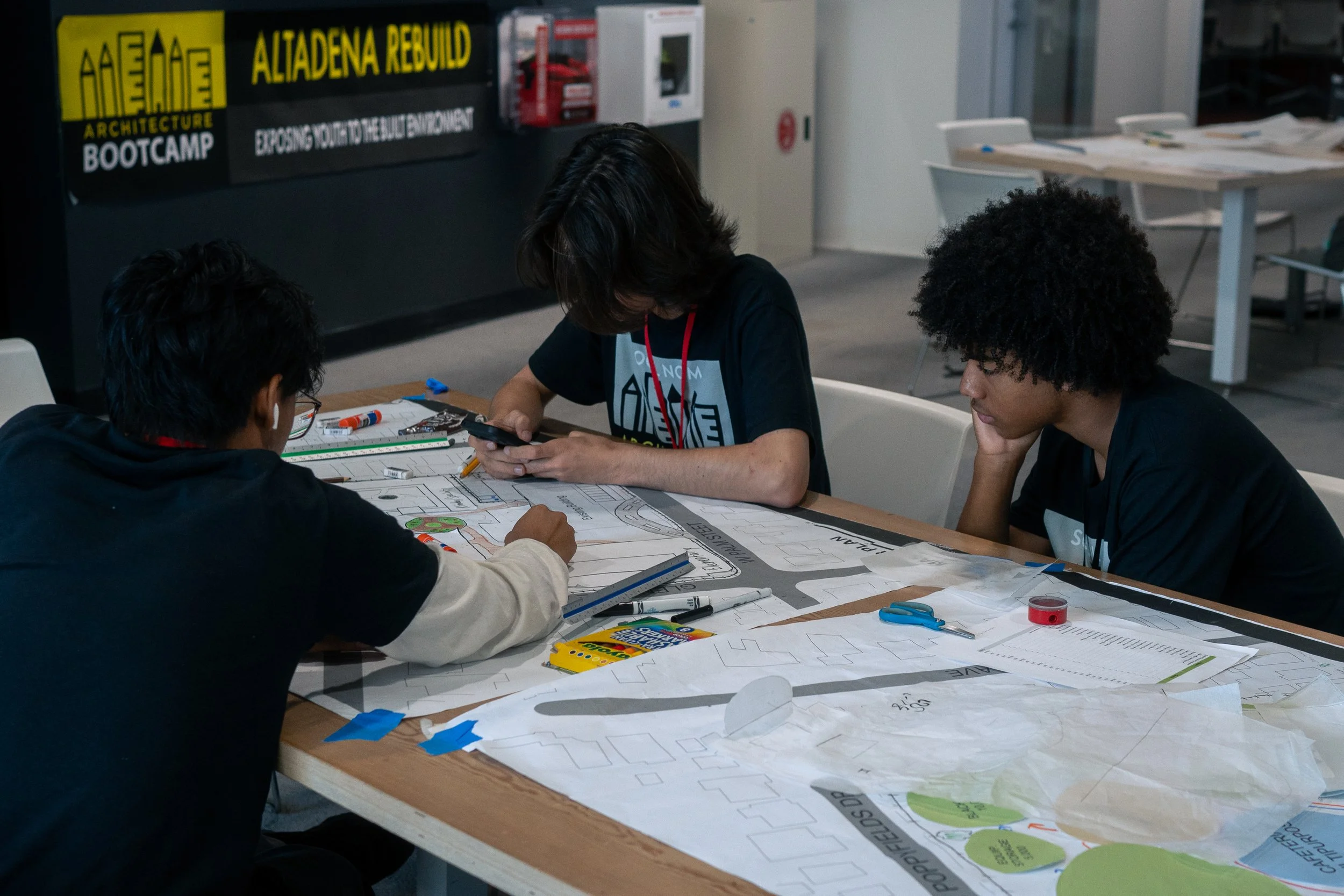 A group of high school students reviews architecture sketches at Santa Monica College's Center for Media and Design during the SoCal NOMA Architecture Boot Camp on Friday, July 24, in Santa Monica, Calif. The annual six-month program focuses on expo