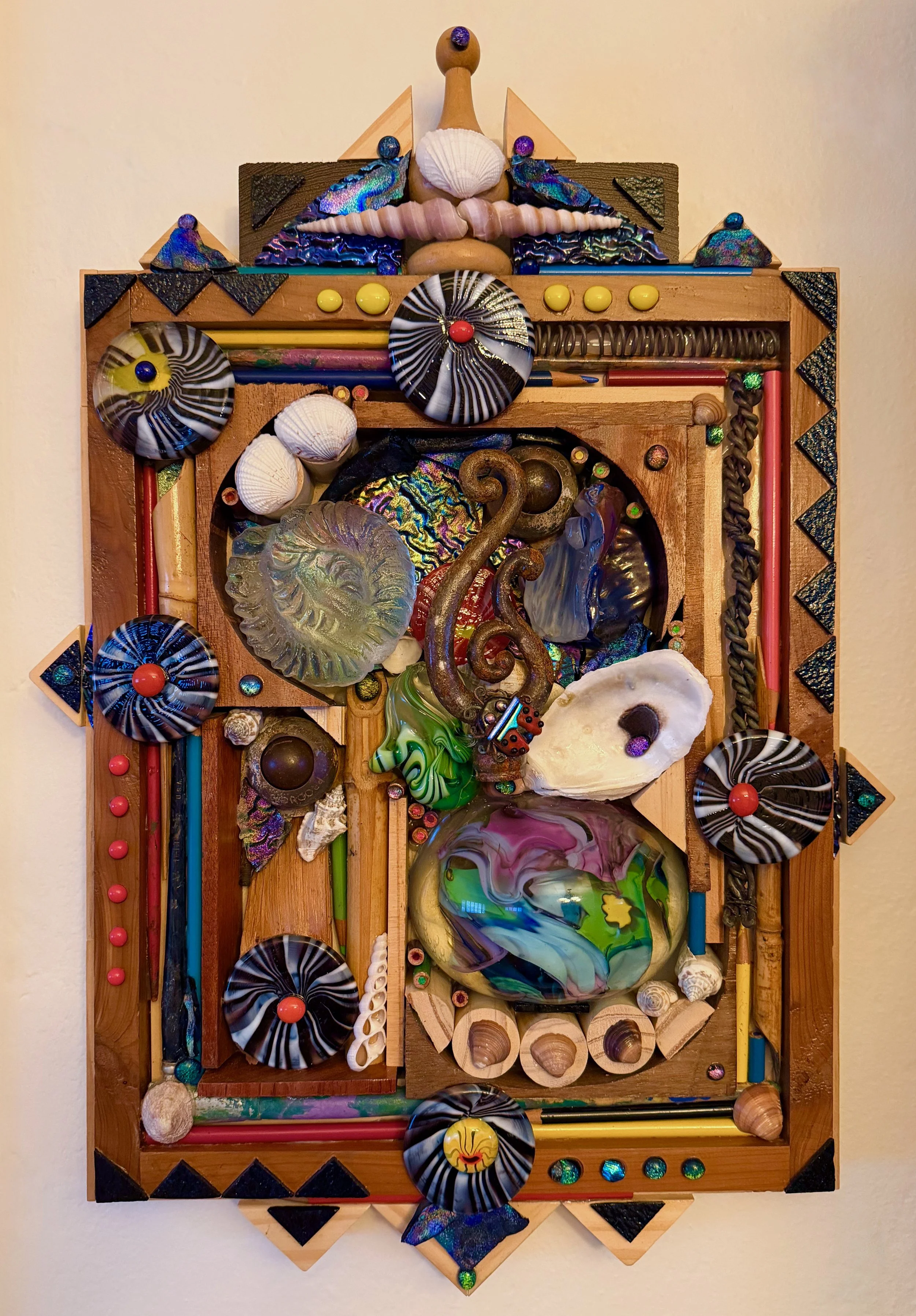 Photo of glass art, "Compass: Finding Our Way." Glass elements represent things from the past, and also looking into the future. Mixed Media: glass, wood, metal and found objects. (Courtesy of the artist: Terri Bromberg)  