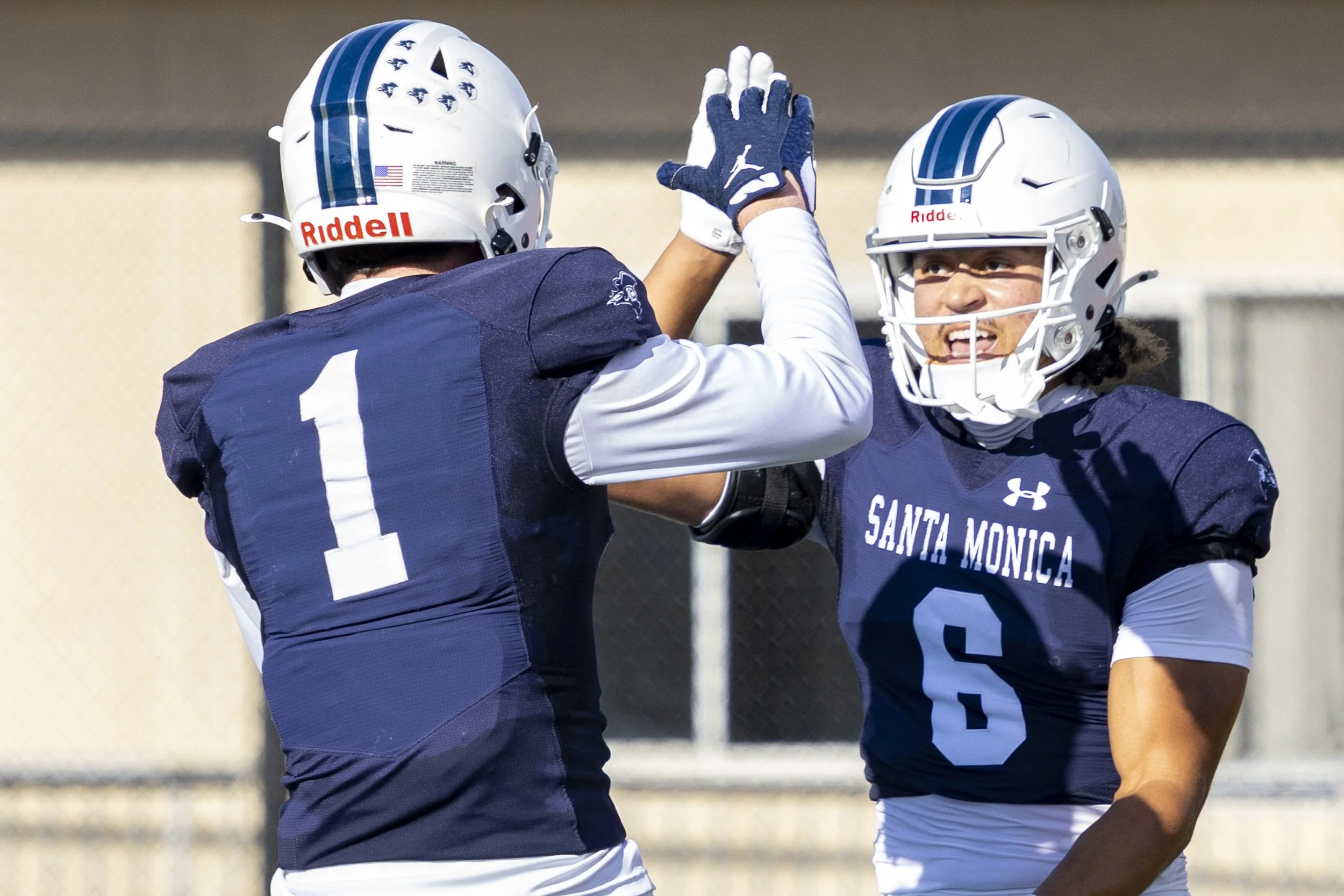  (L-R) Santa Monica College (SMC) Men’s Football Corsairs and wide receivers Braydon Sanford (1) and Amir Smith (6) celebrate Smith’s catch of a 32-yard pass and first touchdown of the game against the Compton College Coyotes on Saturday, Sept. 5, 20