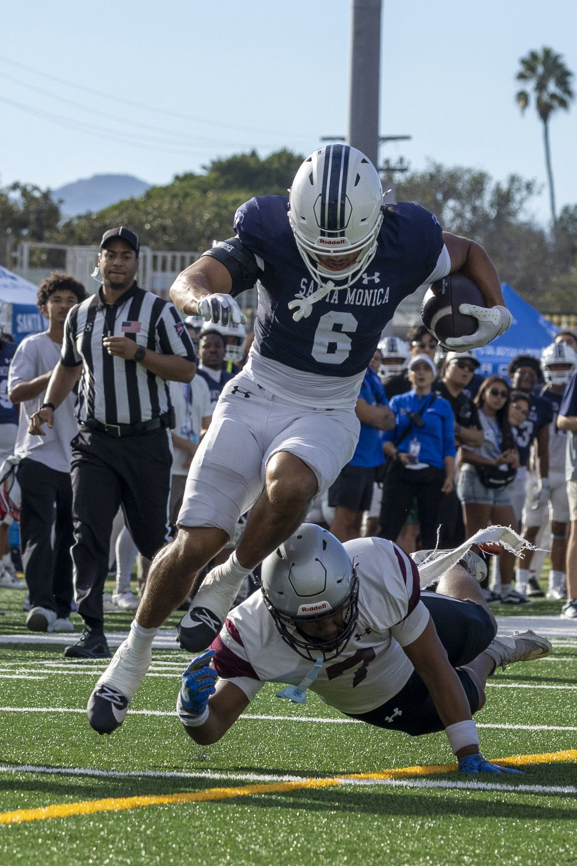 Santa Monica College (SMC) Men’s Football Corsair and wide receiver Amir Smith (6), runs with the ball as Compton College Coyotes Nasir Jenkins (7) tackles him during their game on Saturday, Sept. 5, 2026, at the SMC Corsair Field in Santa Monica, C